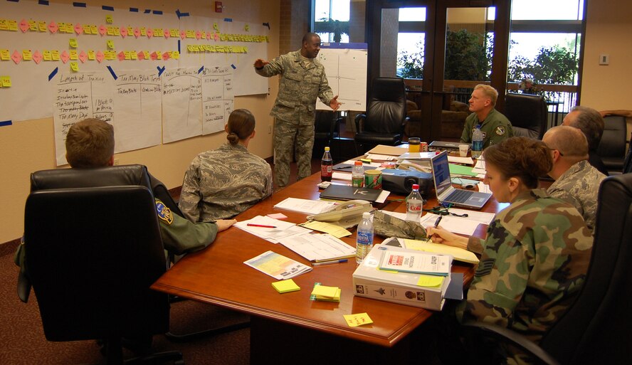 LAUGHLIN AIR FORCE BASE, Texas – Chief Master Sgt. Daryl Grant, 47th Operations Group briefs his boss, Col. Martin Schans, 47th Operations Group commander and members of Team XL during an AFSO21 event at Laughlin. The goal of the Oct. 27-31 event was to lower the time it takes to train an Air Traffic Controller from 15 months to between six and nine months. AFSO21 is a set of tools used to provide a standard Air Force approach to continuously improve all processes that employ AF capabilities to deliver required effects, develop a culture which promotes elimination of waste and ensure that all Airmen understand their role. (U.S. Air Force photo by George McKnight)