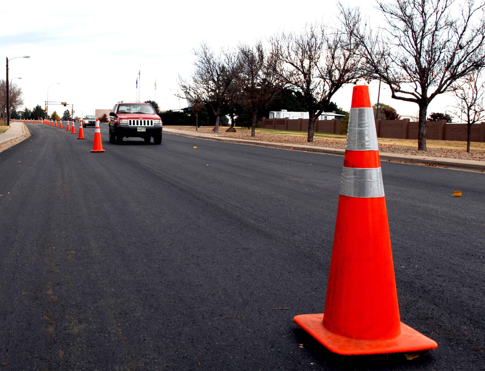 CANNON AIR FORCE BASE, N.M. - A motorist winds around safety cones on DL Ingram Ave. on Nov. 3. Although Ingram has been opened for traffic, drivers should continue to exercise caution as the project is expected to be completed Nov. 10. (Air Force photo by Greg Allen)