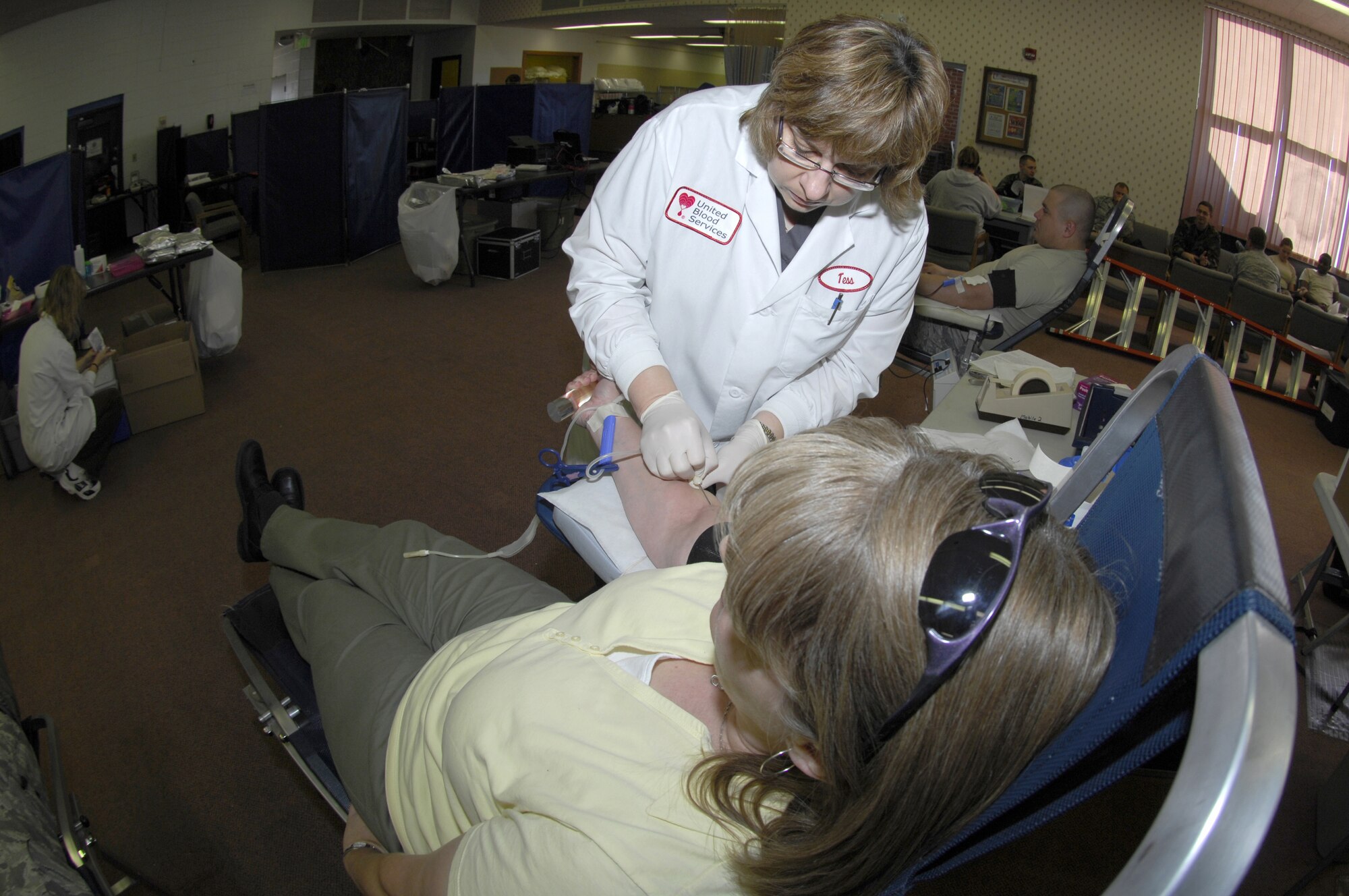 MINOT AIR FORCE BASE, N.D. -- Tess Bott, a United Blood Services nurse, inserts a needle into Karen Most, 5th Communications Squadron, during a blood drive here Oct. 29. Members from the base volunteered their time to donate blood in support of more than 74 hospitals across N.D. (U.S. Air Force photo by Tech. Sgt. Lee A. Osberry Jr.)  