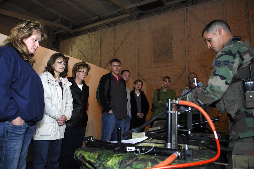 MINOT AIR FORCE BASE, N.D. -- Senior Airman Christopher Ramirez, 791st Missile Security Forces Squadron tactical response force member, shows members of the Minot Area Chamber of Commerce's Community Leadership Institute the tools of his trade during a base tour here Oct. 30. The purpose of the CLI tour was to inform and educate members of the community on what Airmen at Minot AFB do on a day-to-day basis. During the one-day tour, the group visited the 5th Bomb Wing and the 91st Missile Wing. (U.S. Air Force photo by Senior Airman Wesley Wright)