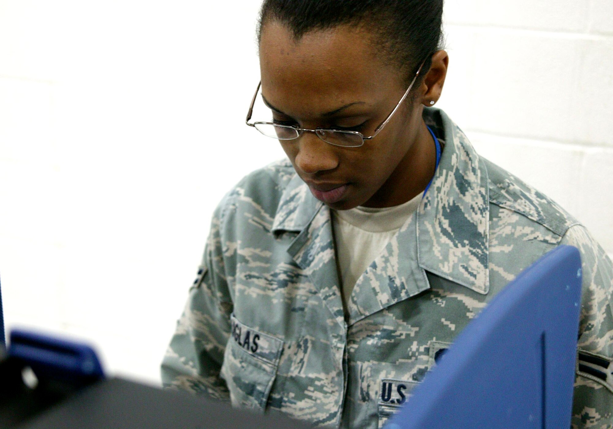 SHAW AIR FORCE BASE, S.C.-- Airman 1st Class Christina Douglas, 20th Intelligence Operations, casts her vote at Shaw Heights Elementary School here Nov. 4. Airman Douglas is one of 1,076 voters who is registered in the Shaw precinct.