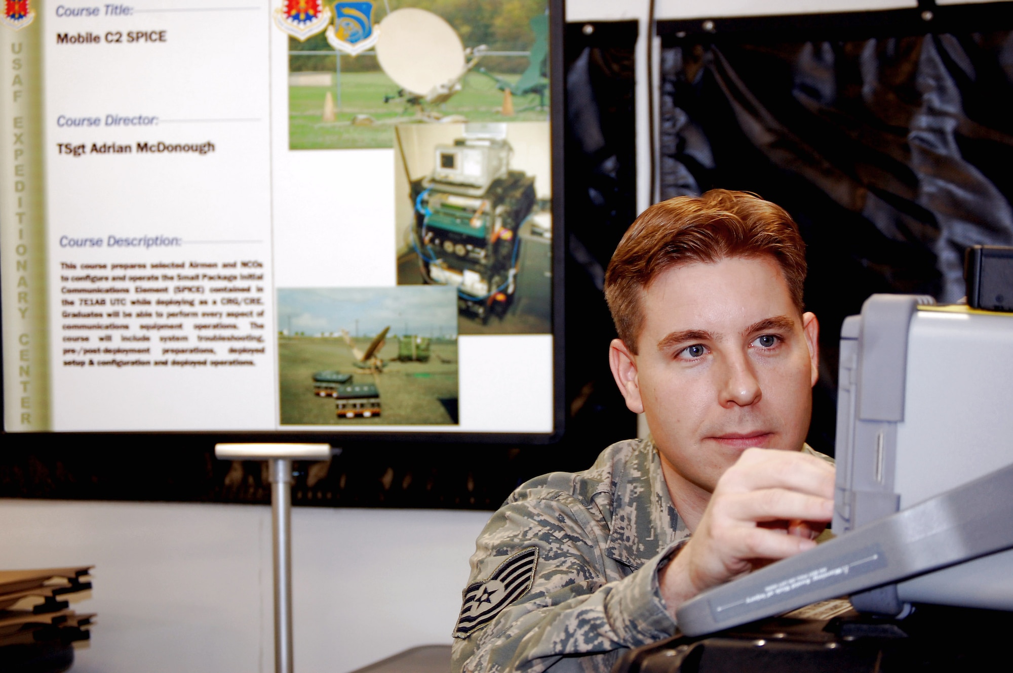 Tech. Sgt. Adrian McDonough prepares equipment in a Small Package Initial Communications Element package for use in the Mobility Operations School's mobile command, control and communications training facility on the expeditionary center campus Oct. 29 at Fort Dix, N.J. The SPICE Course is a new course in the MOS starting in February 2009. Sergeant McDonough is the course director for the U.S. Air Force Expeditionary Center's SPICE Course. (U.S. Air Force Photo/Tech. Sgt. Scott T. Sturkol)