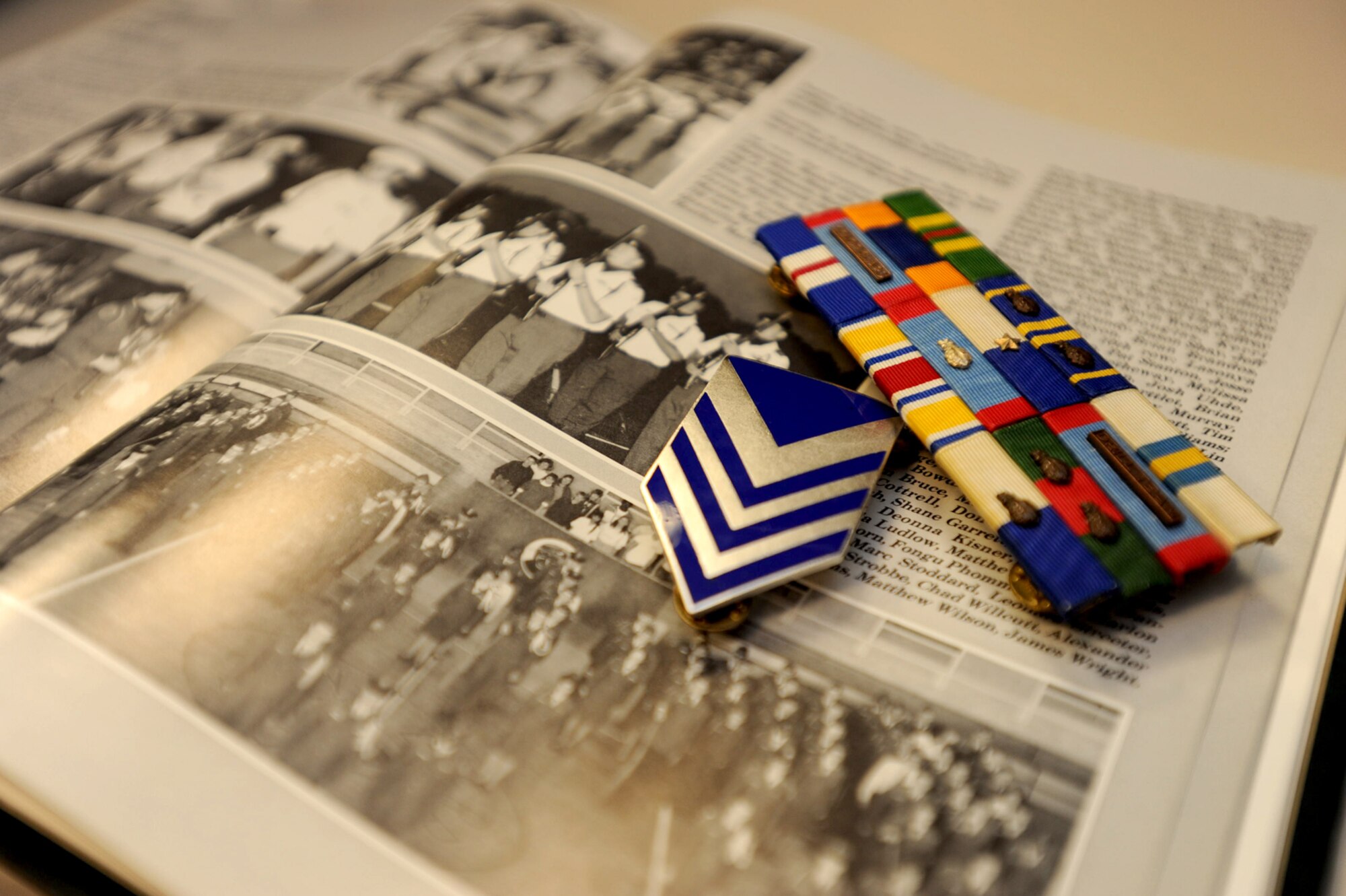 Rank and ribbons from Master Sgt. William Souder's Air Force Junior Reserve Officer Training Corps uniform sit above the yearbook from when he graduated the program at Derby High School in 1991. Sergeant Souder is a Heating, Ventilation and Air Conditioning supervisor assigned to the 931st Civil Engineer Squadron, an Air Force Reserve unit at McConnell Air Force Base, Kan. (U.S. Air Force photo/Tech. Sgt. Jason Schaap)