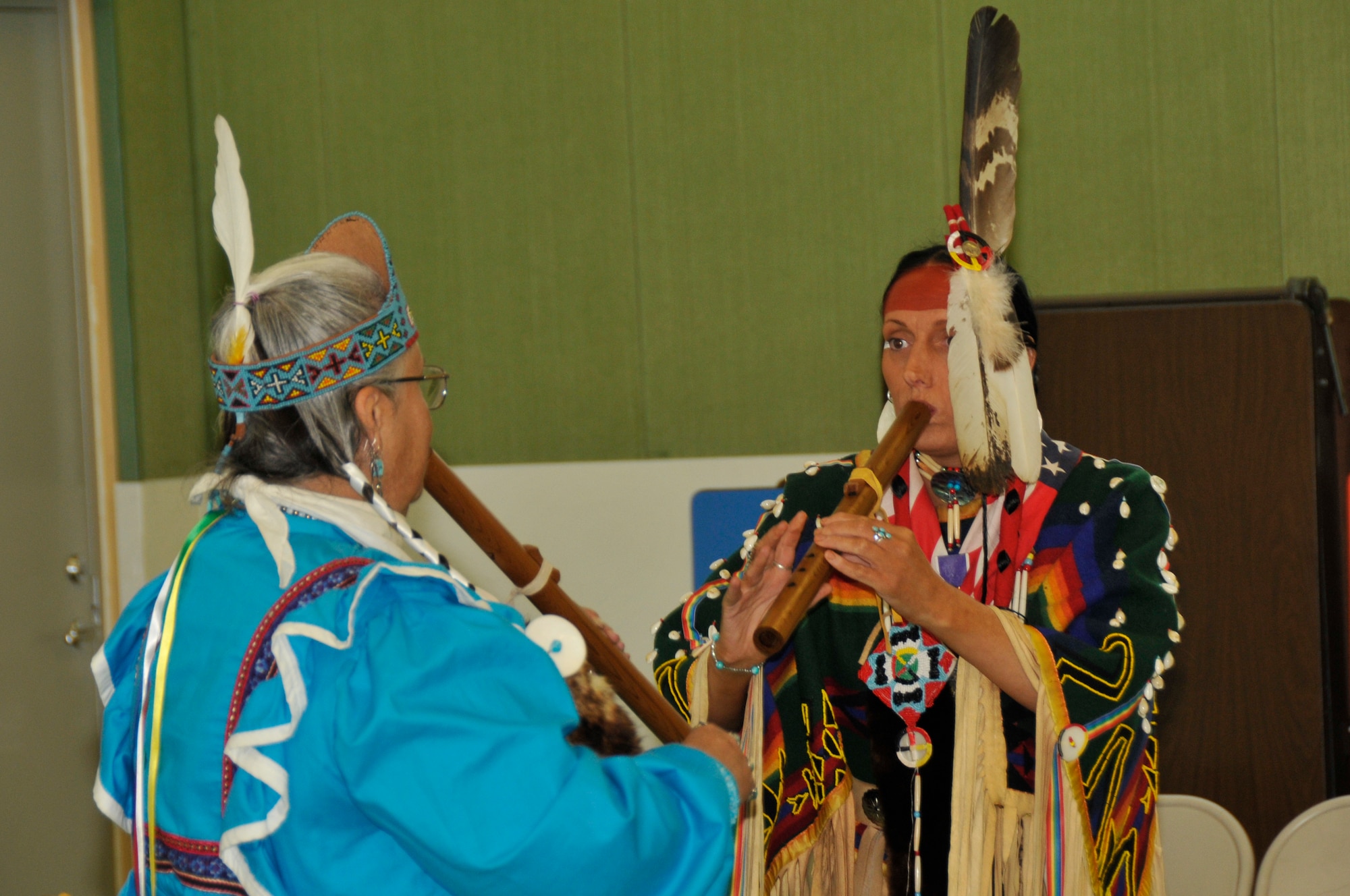 Ohoyu Anoli Hekia a Choctaw Indian and Shunkaha Wanagawin of the Lakota Nation, have a native American flute competition Nov. 4 at RAF Lakenheath, England. Native Americans visited the Liberty Intermediate school to teach students about Native American Culture. (U.S. Air Force photo by Airman 1st Class Perry Aston) 