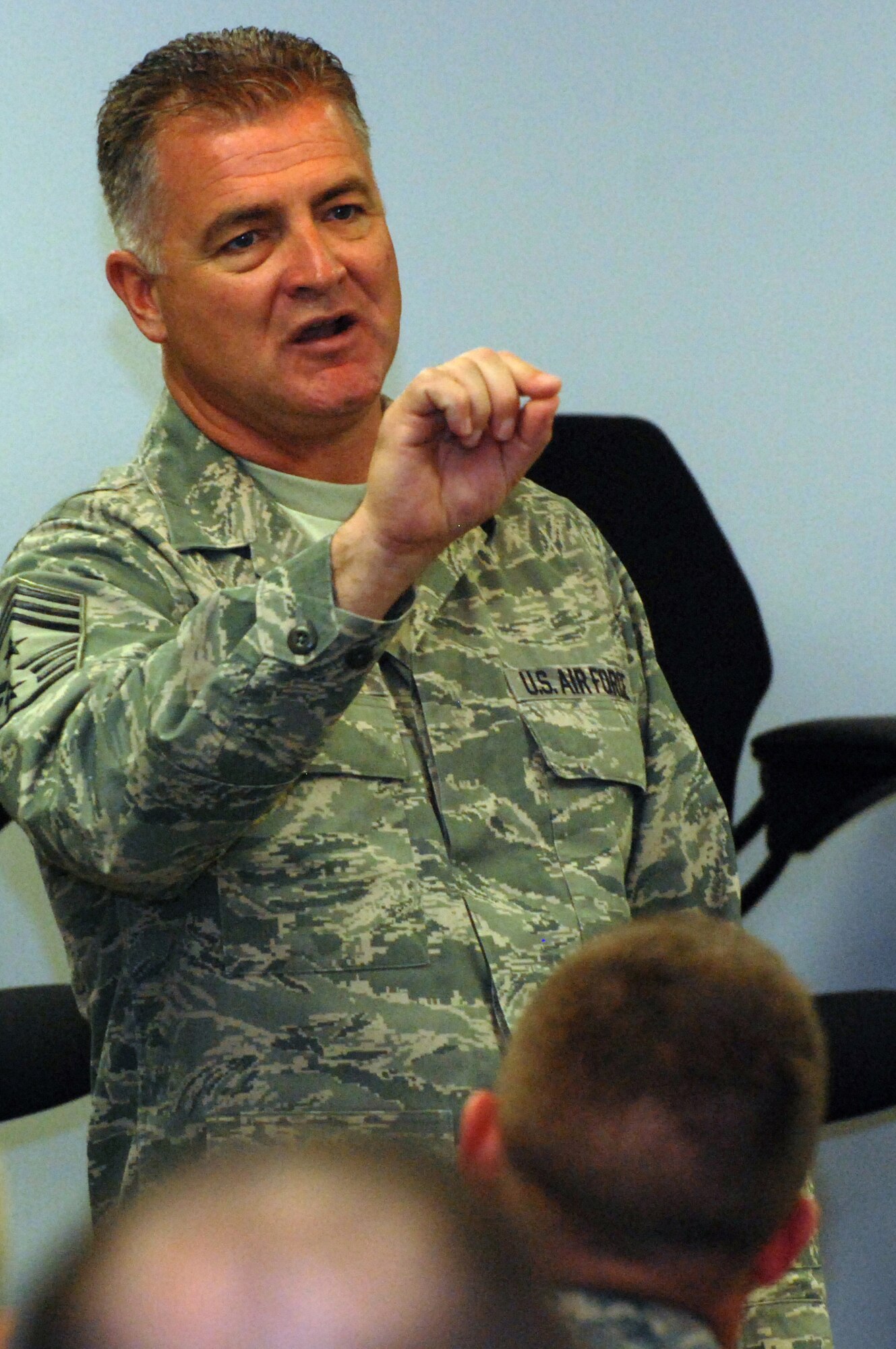 Chief Master Sgt. Troy McIntosh, command chief master sergeant for Air Force Reserve Command, speaks to a group of about 100 Airmen during a 512th Airlift Wing chief's panel at Dover Air Force Base, Del. The open question-and-answer forum was part of the AFRC wing's first-ever Airman's Weekend held during a unit training assembly Nov. 1, 2008. (U.S. Air Force photo/Staff Sgt. Steve Lewis)