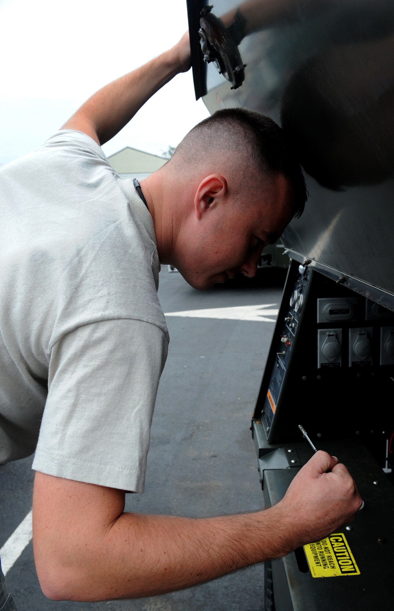LANGLEY AIR FORCE BASE, Va. -- Senior Airman Shaun Beggs, 1st Equipment Maintenance Squadron aerospace ground equipment technician, checks the oil on a FL-1D Lite Cart Oct. 17.  The Aerospace Ground Equipment Flight delivers, maintains and inspects equipment that directly supports the F-15s and F-22s assigned to Langley.  (U.S. Air Force Photo/Airman 1st Class Zachary Wolf)