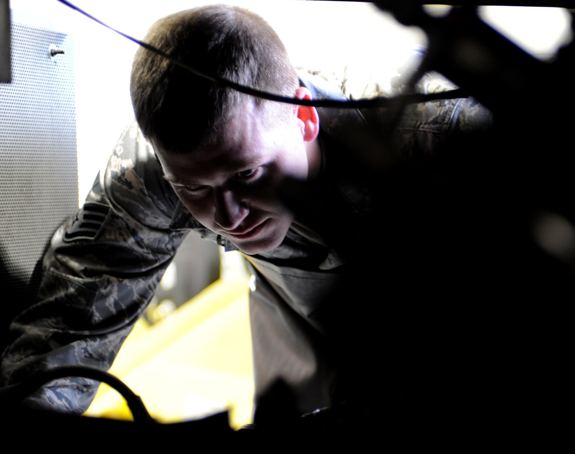 LANGLEY AIR FORCE BASE, Va. – Staff Sgt.  Michael Snyder, 1st Equipment Maintenance Squadron aerospace ground equipment craftsman, inspects equipment for damage Oct. 17. The Aerospace Ground Equipment Flight delivers, maintains and inspects equipment that directly supports the F-15s and F-22s assigned to Langley.  (U.S. Air Force Photo/Airman 1st Class Zachary Wolf)