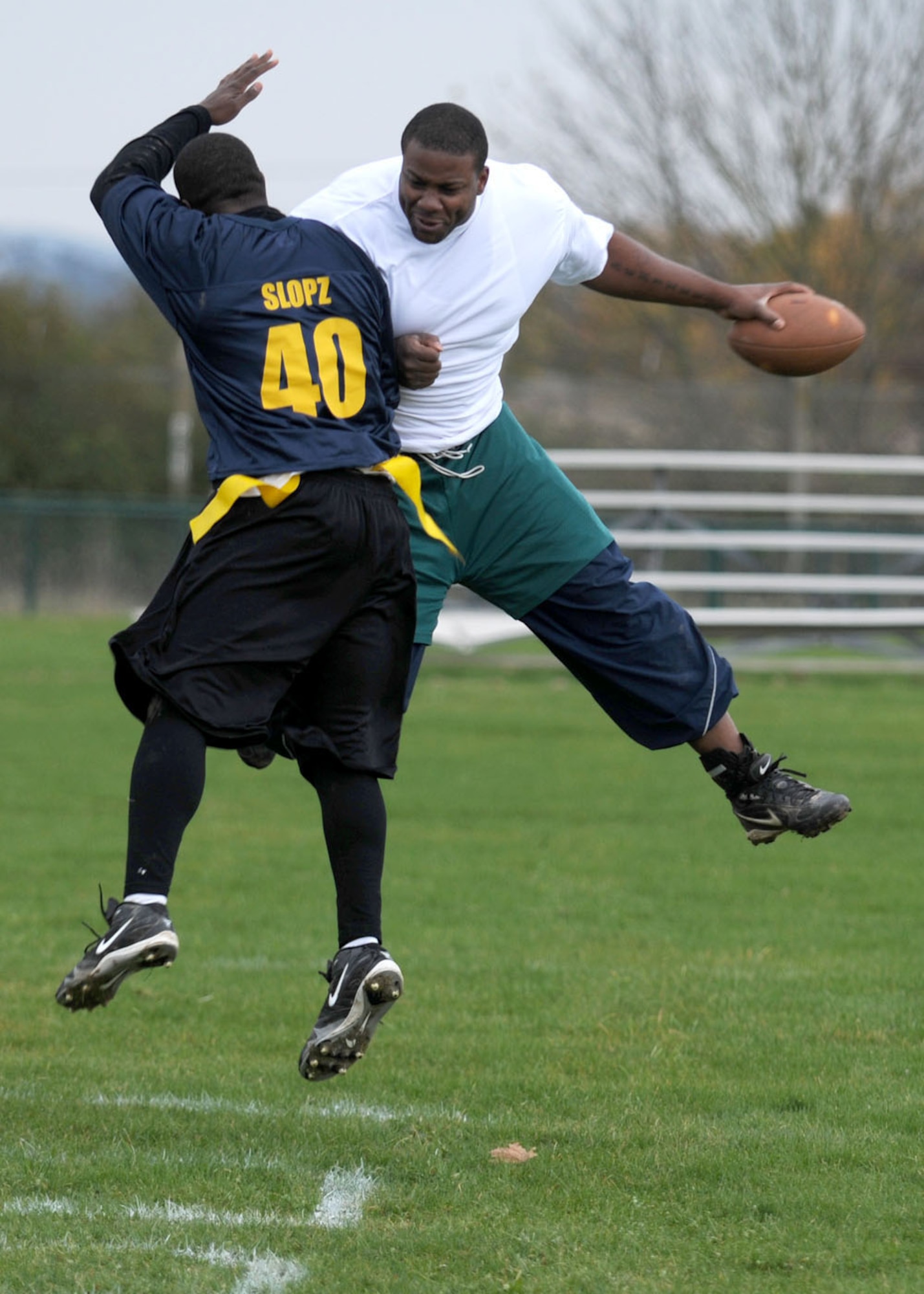 Perry Davis from the 100th Communications Squadron celebrates with Richard Hyslop after converting a 2-point conversion during the flag football championship game Nov. 1, 2008, at RAF Mildenhall, England. The communications squadron defeated the logistics readiness squadron with a 1 point victory with the final score of 14-13. (U.S. Air Force photo by Staff Sgt. Jerry Fleshman)