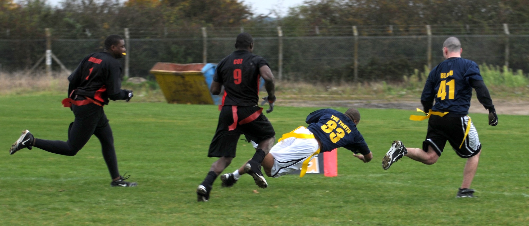 Antonio Edwards, from the 100th Communications Squadron dives into the end zone for a touchdown during the flag football championship game Nov. 1, 2008, at RAF Mildenhall, England. The communications squadron defeated the logistics readiness squadron with a 1-point victory with the final score of 14-13. (U.S. Air Force photo by Staff Sgt. Jerry Fleshman)