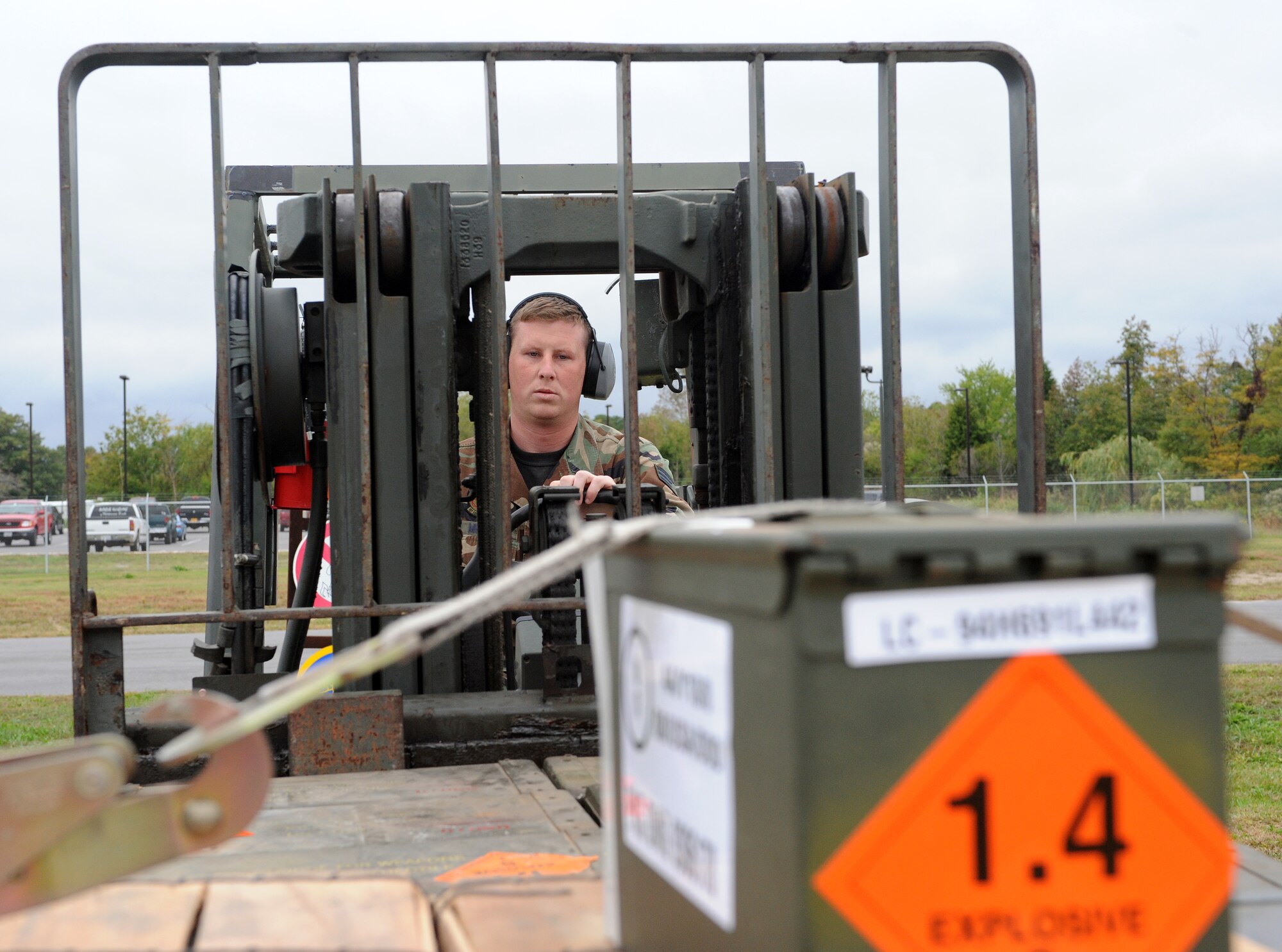 LANGLEY AIR FORCE BASE, Va. -- Senior Airman Shane Miller, 1st Equipment Maintenance Squadron munitions storage crew member, moves ammunition to be stored in the warehouse Oct. 17. The munitions flight provides the things that go boom. The flight can support any aircraft with missiles, bombs, small arms ammunition, and counter measures, including aircraft supporting Operation Noble Eagle.  (U.S. Air Force Photo/Airman 1st Class Zachary Wolf)