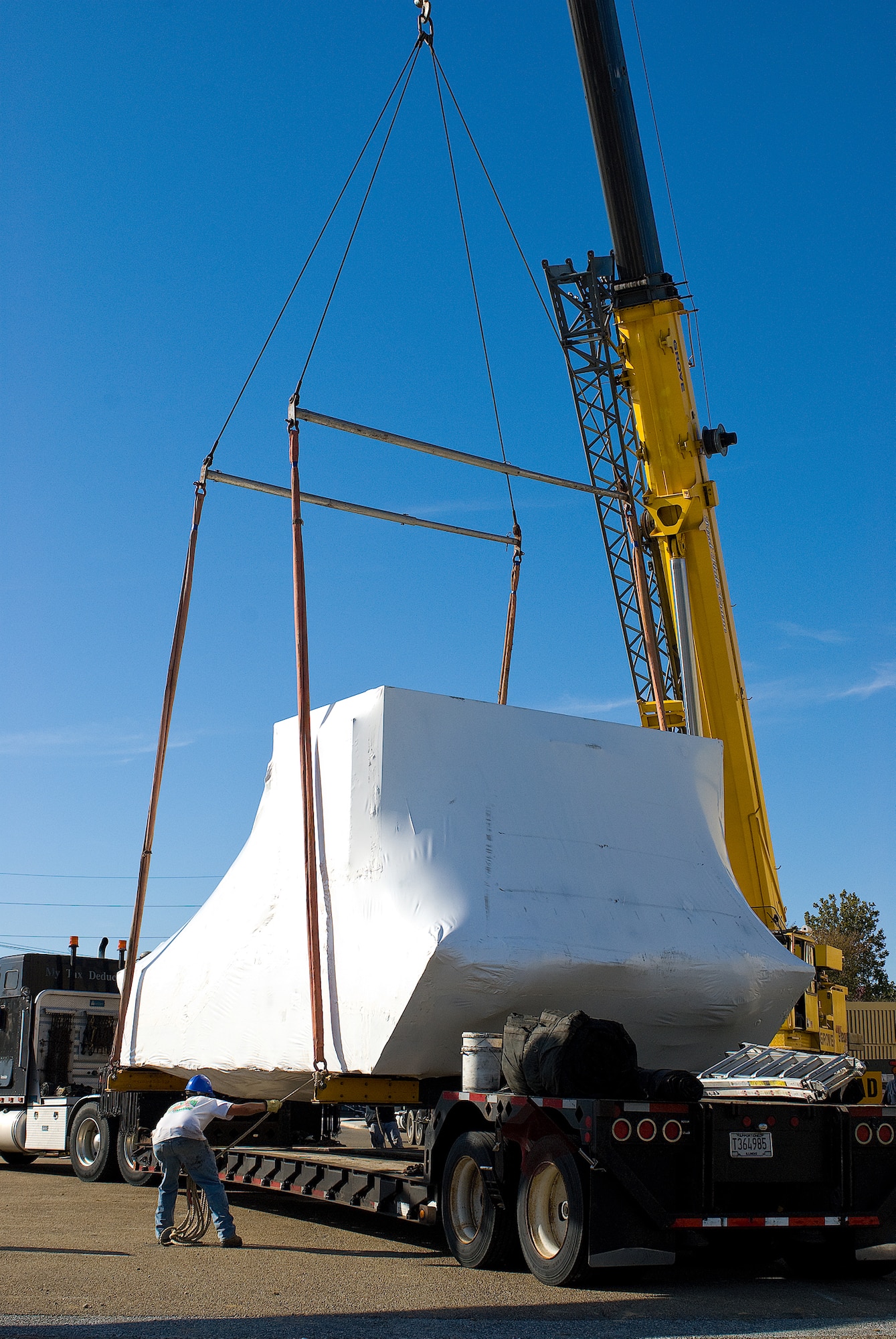 DOVER AIR FORCE BASE, Del. -- Contractors deliver and unload a new C-5 Galaxy simulator at Dover AFB Oct. 10. This new C-5 simulator has a modernized glass cockpit and avionics upgrade as part of the Avionics Modernization Program. 
(U.S. Air Force photo/Roland Balik)