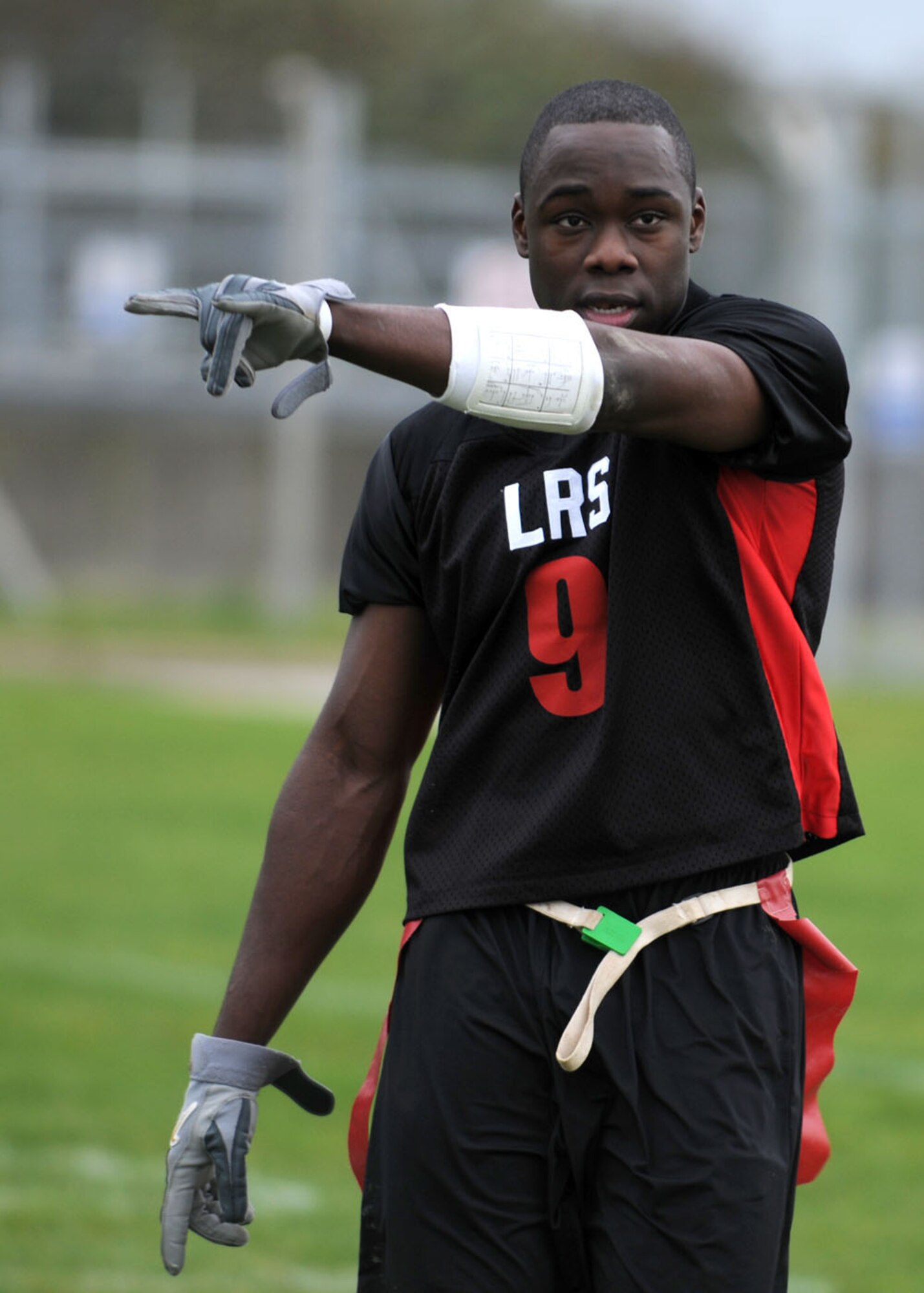 Venti Cozart from the 100th Logistics Readiness Squadron directs the defense during the flag football championship game Nov. 1, 2008, at RAF Mildenhall, England. The logistics readiness squadron fell 1 point short, losing to the communications squadron with a score of 14-13. (U.S. Air Force photo by Staff Sgt. Jerry Fleshman)
