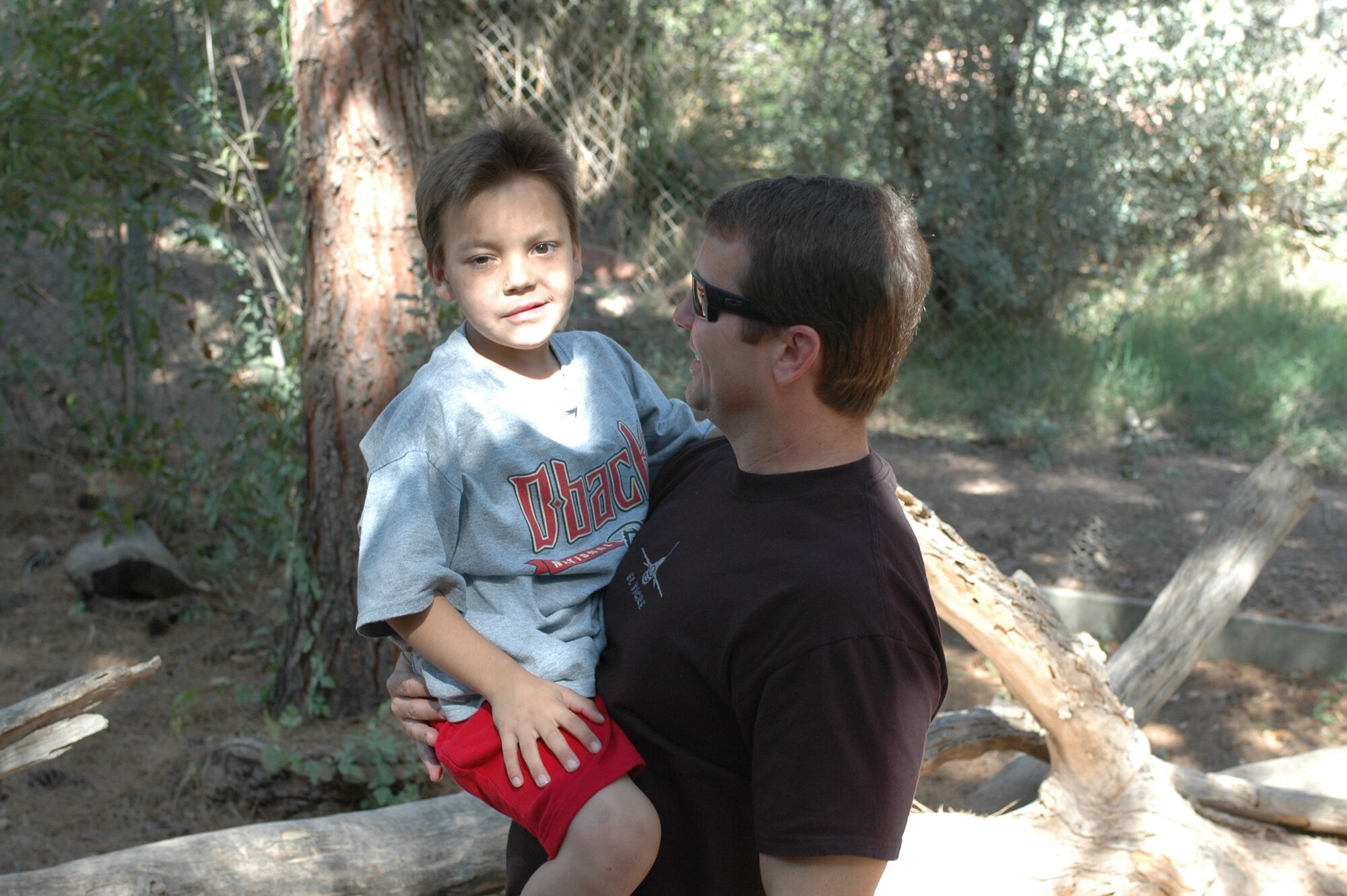 Dominic Magne and Lt. Col. Scott Reinhold enjoy a day at the Phoenix Zoo, Oct. 30. The second-grader and the F-16 pilot have remained friends since Dominic visited the 162nd Fighter Wing in Tucson, Ariz., last year to fulfill his dream to become a fighter pilot. (Air National Guard photo by Capt. Gabe Johnson)