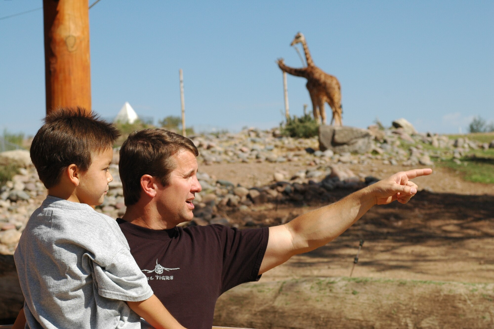 Dominic Magne and Lt. Col. Scott Reinhold, enjoy a day at the Phoenix Zoo, Oct. 30. The second-grader and the F-16 pilot have remained friends since Dominic visited the 162nd Fighter Wing in Tucson, Ariz., last year to fulfill his dream to become a fighter pilot. (Air National Guard photo by Capt. Gabe Johnson)