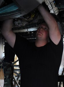 LANGLEY AIR FORCE BASE, Va. – Staff Sgt. Douglas Schonlaw, 1st Equipment Maintenance Squadron inspection section dock chief, inspects hydraulic lines on an F-15C Eagle Oct.  16. One of the biggest roles the maintenance flight plays is in the inspection process. The F-15 is due for inspection every 200 flying hours. (U.S. Air Force Photo/Airman 1st Class Zachary Wolf)