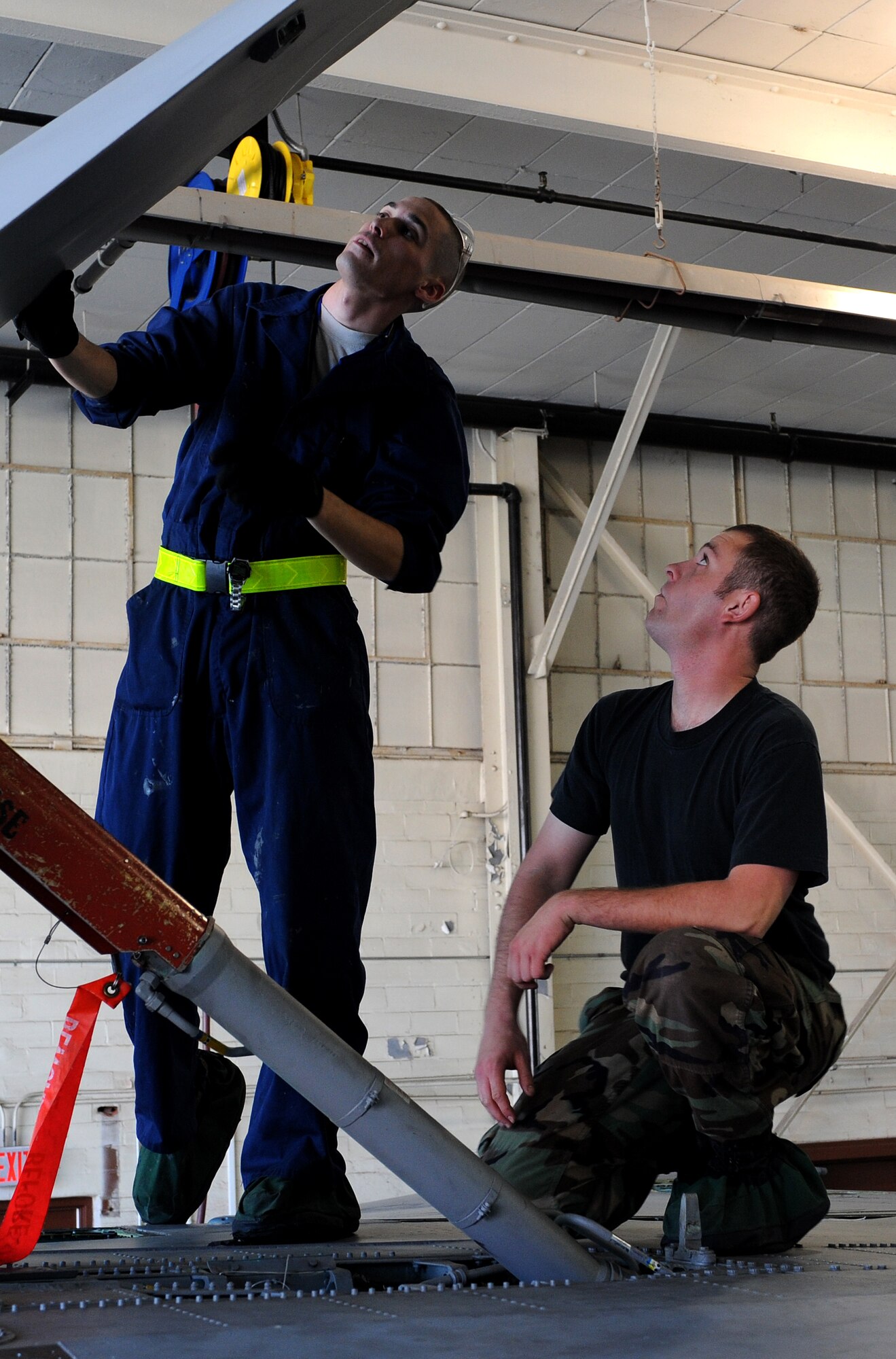 LANGLEY AIR FORCE BASE, Va. – Senior Airman Thomas Lomax, 1st Equipment Maintenance Squadron sheet metal specialist, trains fellow specialist Senior Airman David Brown,  how to properly evaluate a F-15C Eagle speed brake for any damage Oct. 16. One of the biggest roles the maintenance flight plays is in the inspection process. The F-15 is due for inspection every 200 flying hours.  (U.S. Air Force Photo/Airman 1st Class Zachary Wolf)