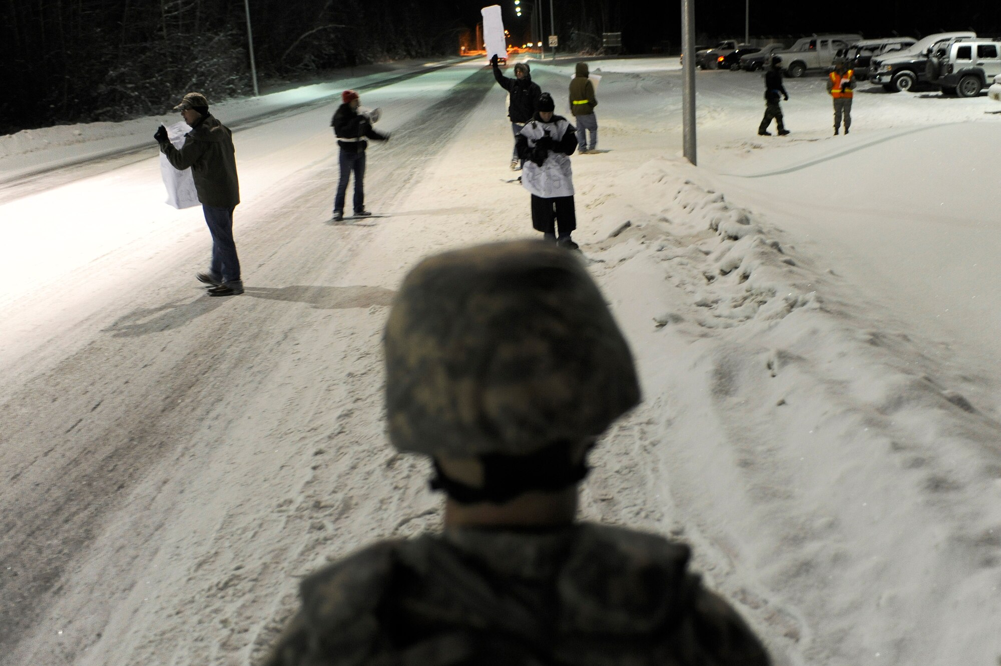Master Sgt. Carroll Stone, 354th Security Forces Squadron, stands guard at Hursey Gate stopping Airmen simulating as protesters from entering onto the installation during a 354th Fighter Wing and 168th Air Refueling Wing combined Operational Readiness Exercise Nov. 3, 2008, at Eielson Air Force Base, Alaska. This exercise trains Airmen how to handle different situations during a mass deployment to support operations in the Pacific Region. (U.S. Air Force photo/Senior Airman Jonathan Snyder)