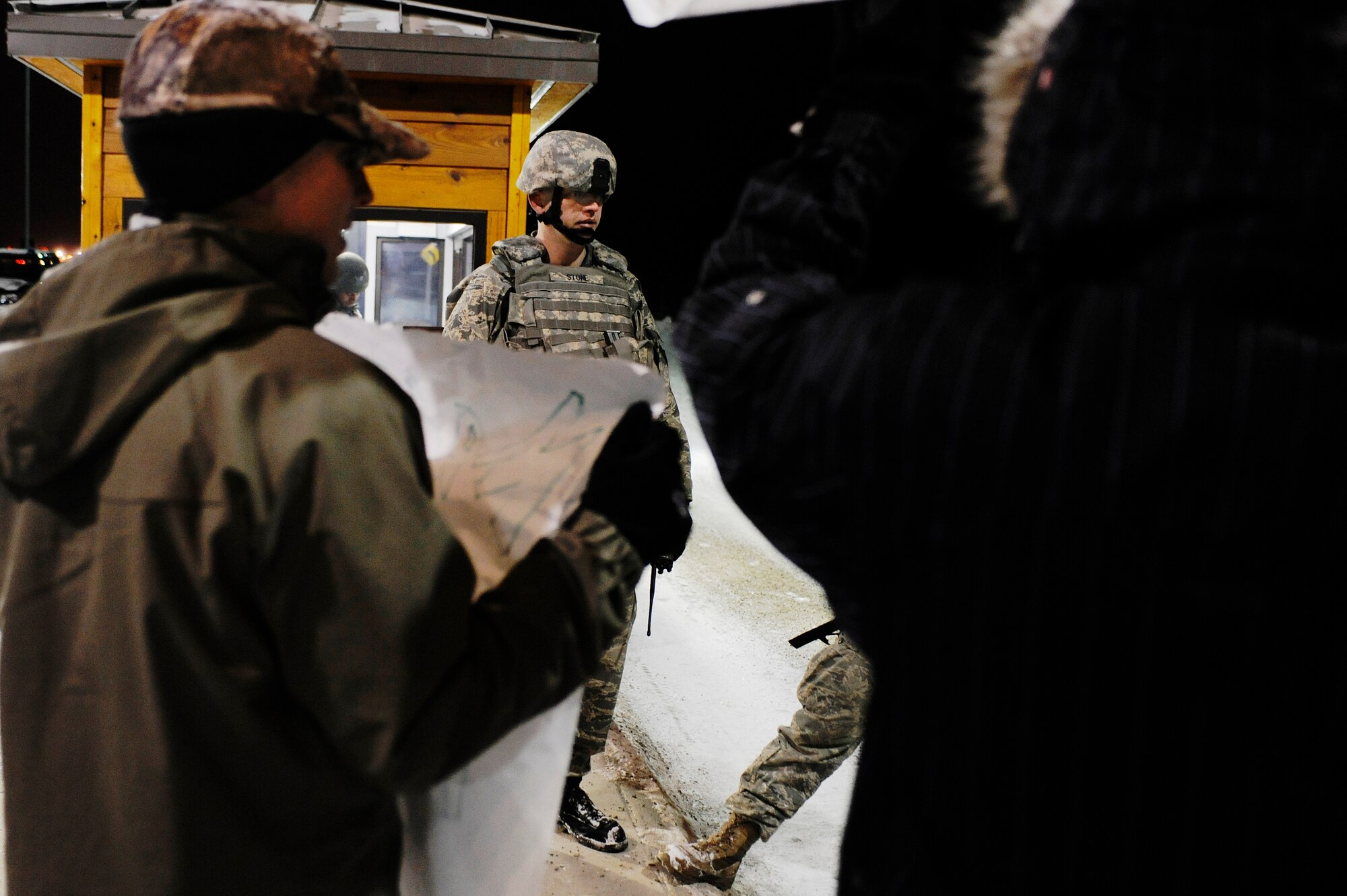 Master Sgt. Carroll Stone, 354th Security Forces Squadron, stands guard at Hursey Gate stopping Airmen simulating as protesters from entering onto the installation during a 354th Fighter Wing and 168th Air Refueling Wing combined Operational Readiness Exercise Nov. 3, 2008, at Eielson Air Force Base, Alaska. The exercise trains Airmen how to handle different situations during a mass deployment to support operations in the Pacific Region. (U.S. Air Force photo/Senior Airman Jonathan Snyder)