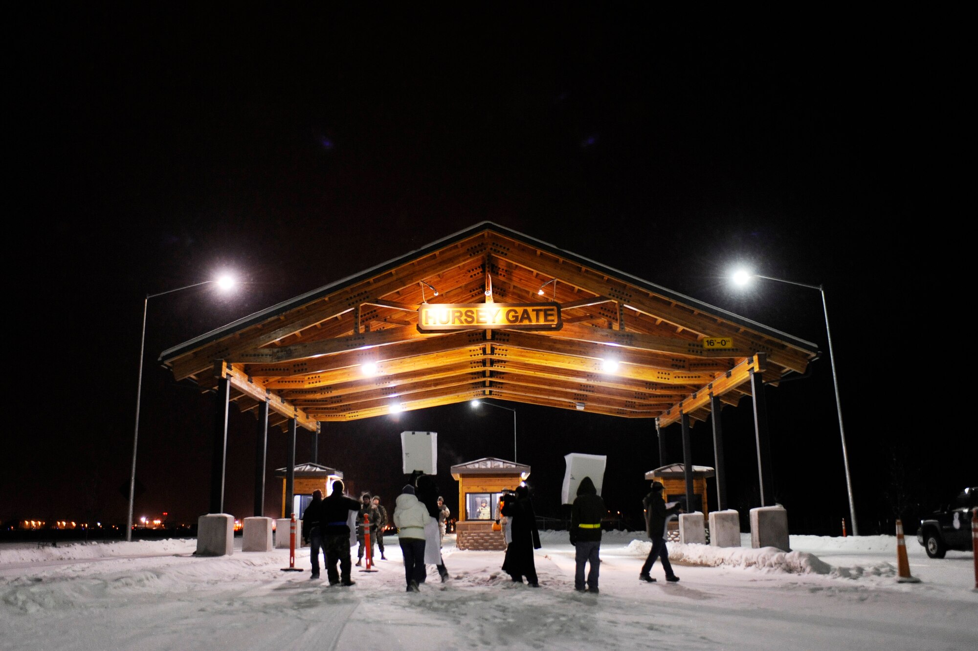 Airmen simulate a protesters outside Hursey Gate, the entrance to Eielson Air Force Base, while security forces Airmen stop them from proceeding any further during a 354th Fighter Wing and 168th Air Refueling Wing combined Operational Readiness Exercise Nov. 3, 2008, at Eielson AFB, Alaska. 354th Security Forces Squadron responded to protesters outside the front gate and quickly took control of the situation moving the protesters back to a safe location. (U.S. Air Force photo/Senior Airman Jonathan Snyder)