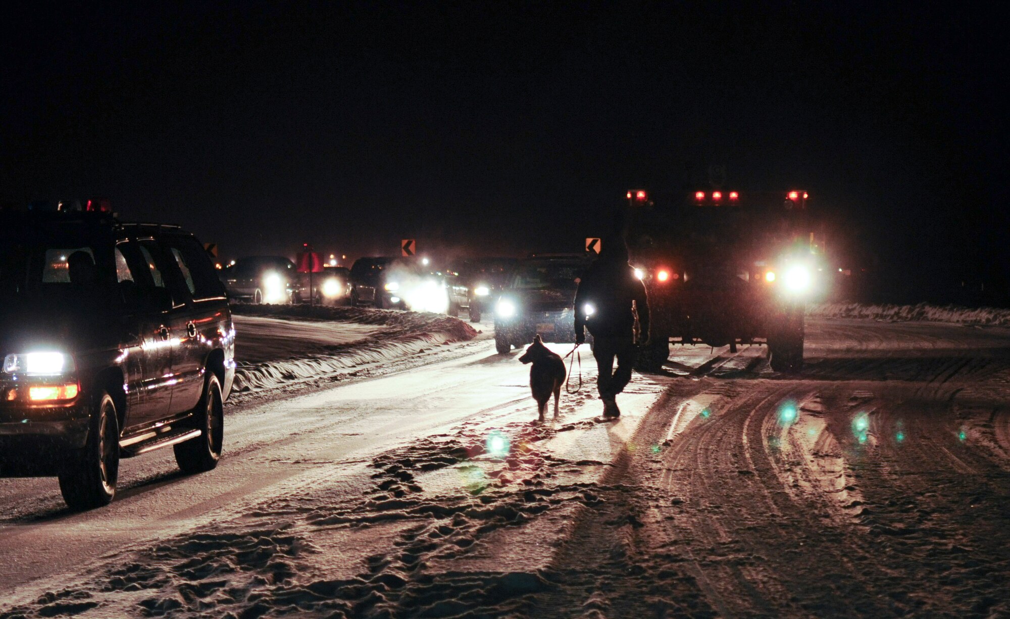 Security Forces Airmen check cars at the gate Nov. 3, 2008, at Eielson Air Force Base, Alaska. The operational readiness exercise is base-wide to ensure Airmen are knowledgeable of their jobs during a simulated, stressful environment. (U.S. Air Force photo/Airman Laura Max) (Released)