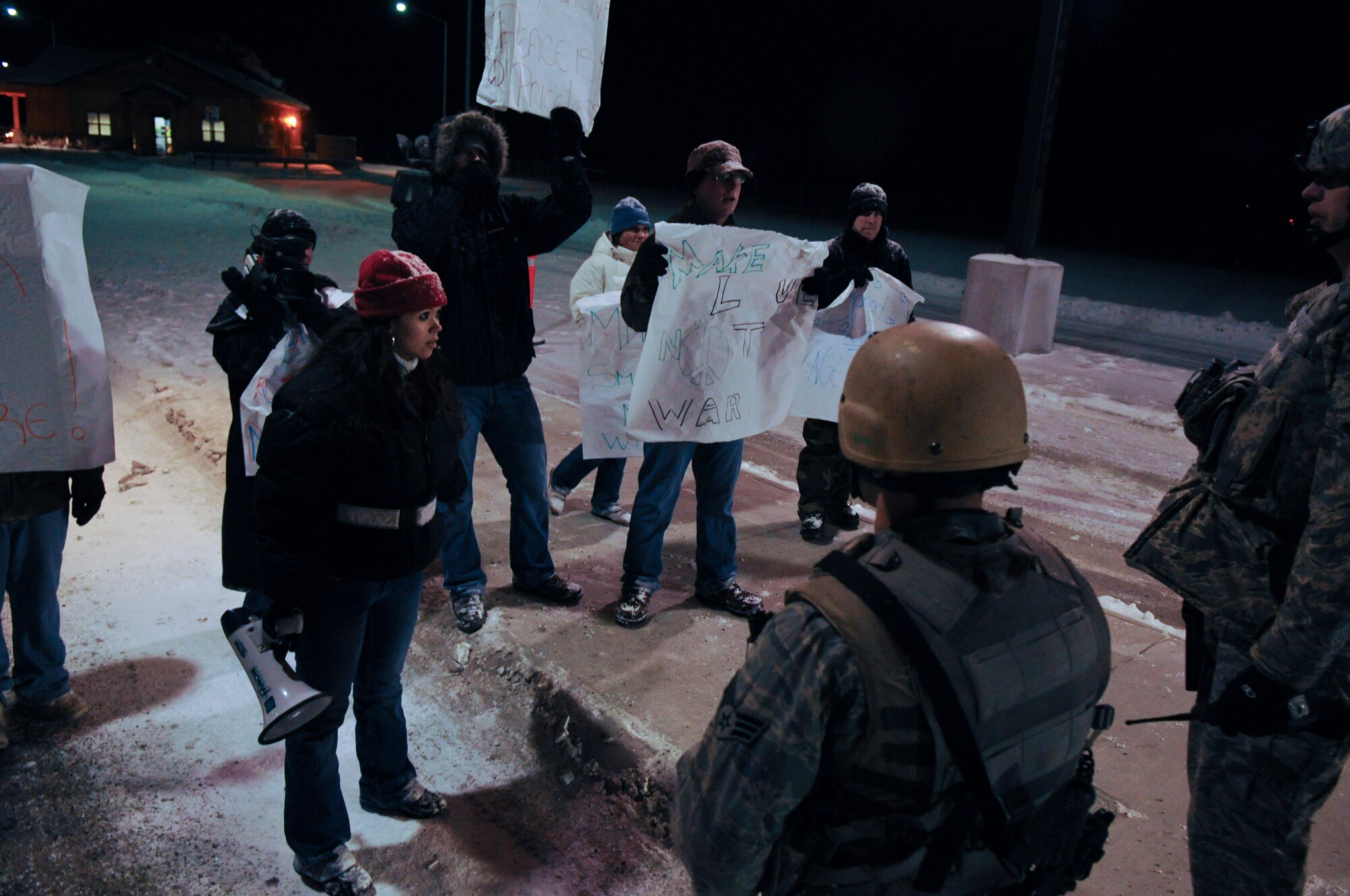 Security Forces Airmen keep protesters from entering Eielson Air Force Base, Alaska on Nov. 3, 2008. The protesters were practicing their First Amendment, Freedom of Speech rights, (during an operational readiness exercise) which the United States of America Armed Forces fights to protect. (U.S. Air Force photo/Airman Laura Max) (Released)