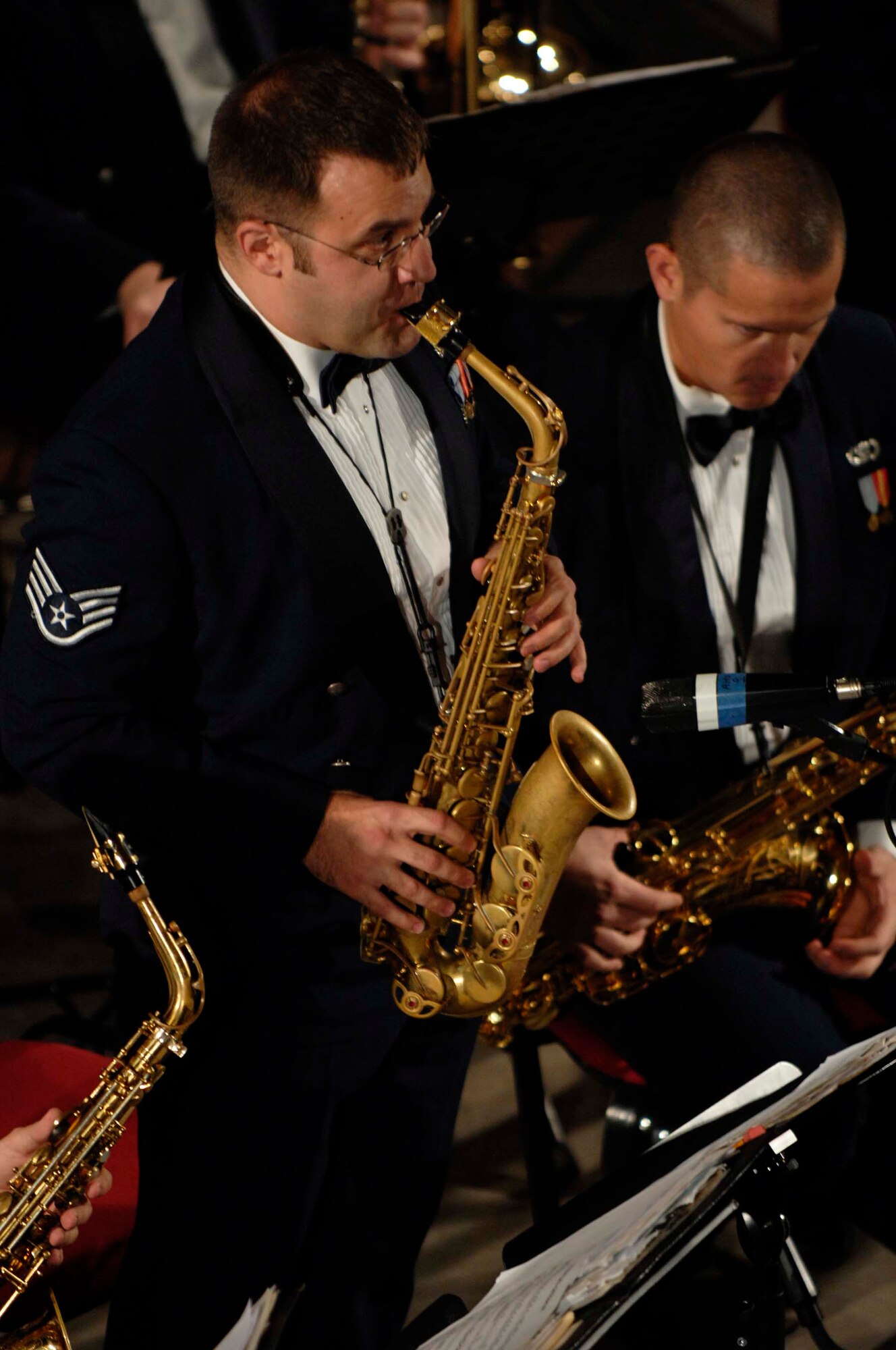 U.S. Air Force Staff Sgt. Derek  Hinderliter, U. S. Air Forces in Europe Concert Band saxophonist, performs a solo during the song "Accentuate the Positive" during a concert at the Maria Filotti Theater, Braila, Romania, Nov. 2, 2008. The USAFE Concert Band brings the sound of America to Europe's finest concert halls and theaters. (U.S. Air Force by Senior Airman Amber Bressler)(Released)