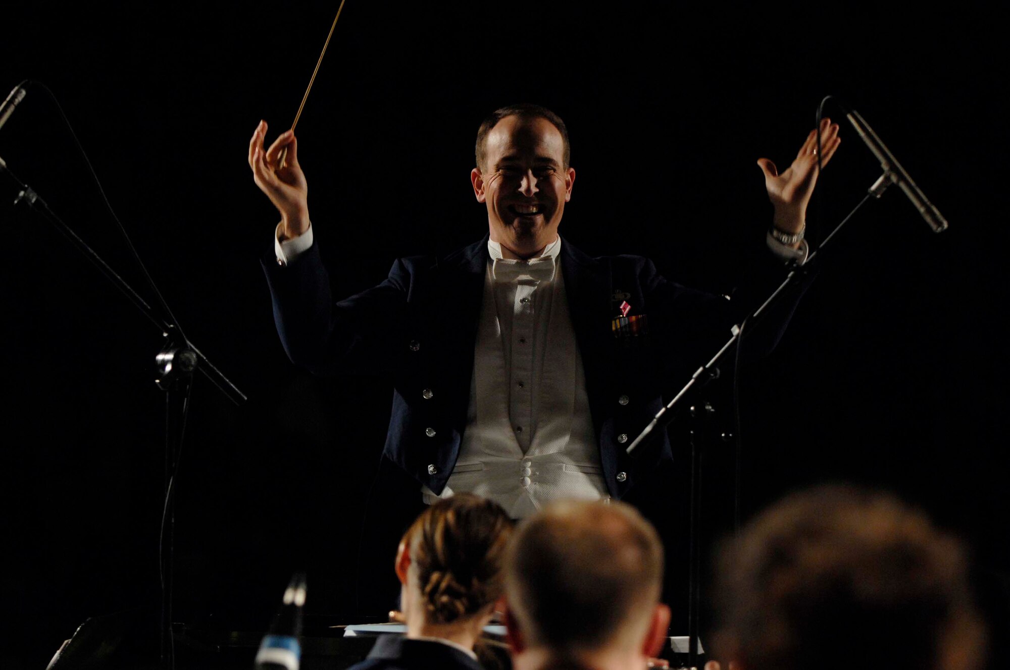 U.S. Air Force Maj. Jeffrey Warner, U.S. Air Forces in Europe band commander, conducts the Concert Band during a performance at the Nae Leonard Musical Theater, Galati, Romania, Nov. 1, 2008. The USAFE Concert Band brings the sound of America to Europe's finest concert halls and theaters. (U.S. Air Force by Senior Airman Amber Bressler)(Released)