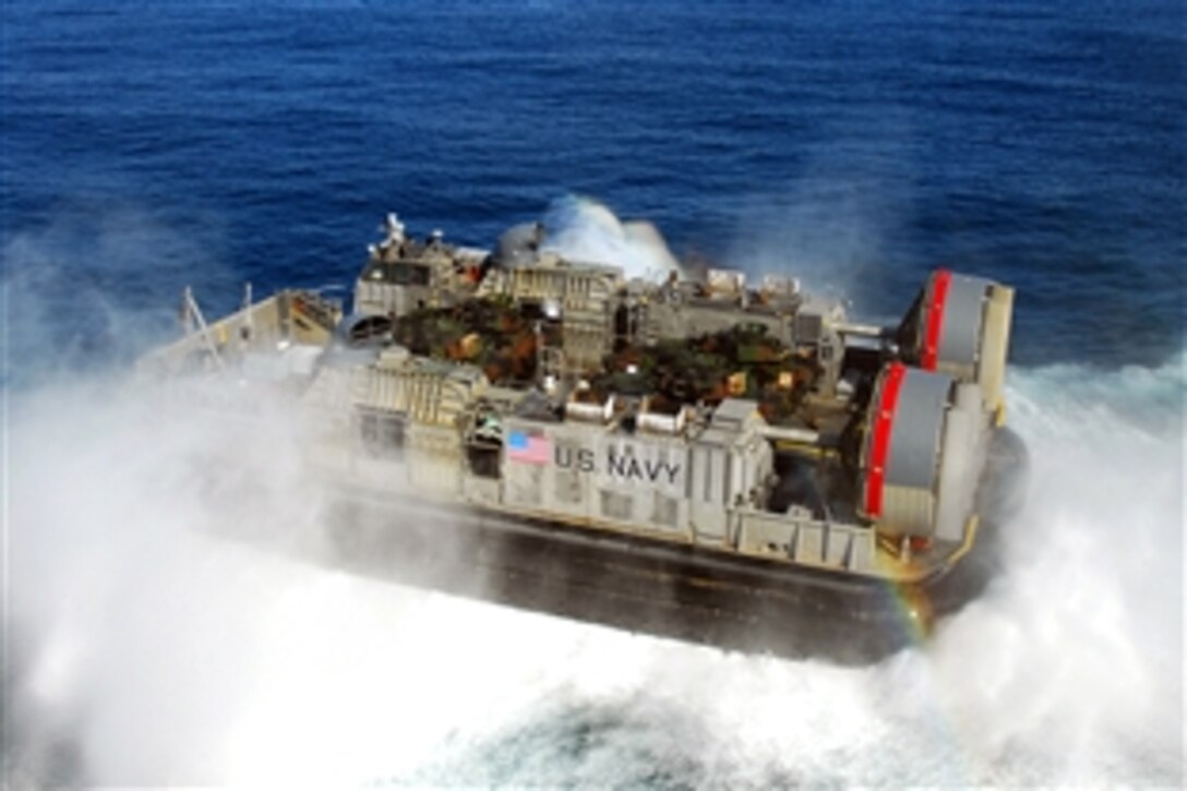 A landing craft air cushion exits the well deck of the USS Peleliu and turns toward the coast of Southern California to disembark Marines at Camp Pendleton, Calif., after a scheduled six-month deployment, Pacific Ocean, Nov. 3, 2008. 