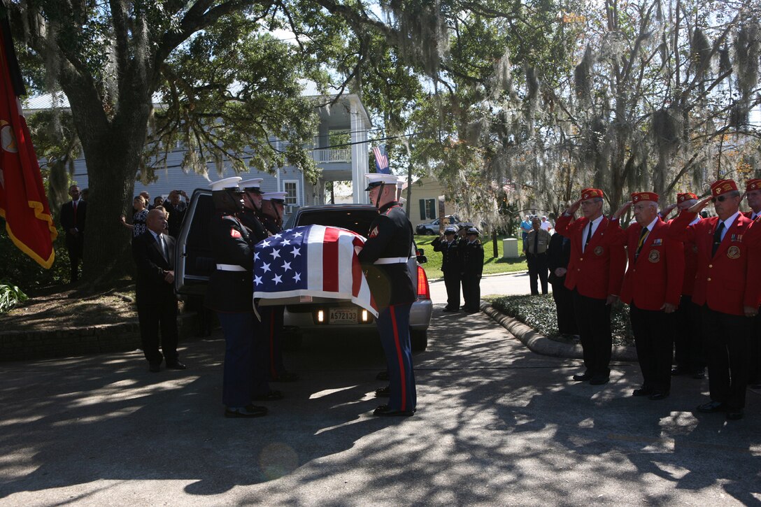 Body bearers from Marine Barracks Washington loaded the coffin of Gen. Robert H. Barrow into a hearse for a procession to funeral services. Barrow died in his sleep Oct. 30.