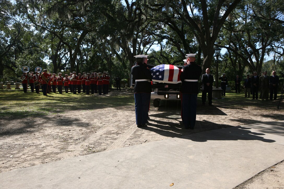 Body bearers unload the casket of Gen. Robert H. Barrow before his funeral service, while the U.S. Marine Band plays Ruffles and Flourishes in his honor. More than 200 Marines were brought from Marine Barracks Washington for the funeral service of the 27th commandant of the Marine Corps.