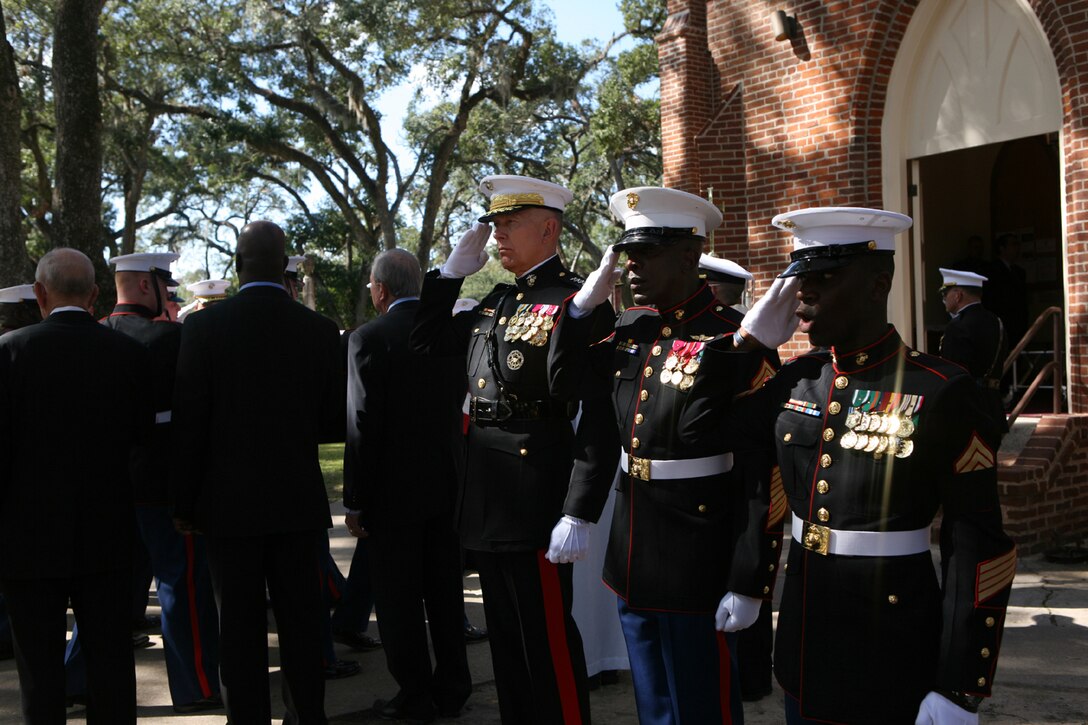 Gen. James T. Conway, commandant of the Marine Corps, Sgt. Maj. Carlton Kent, sergeant major of the Marine Corps, and Gunnery Sgt. William Dixon, Marine Corps funeral director, salute the casket of Gen. Robert H. Barrow before the funeral service for the 27th commandant of the Marine Corps.