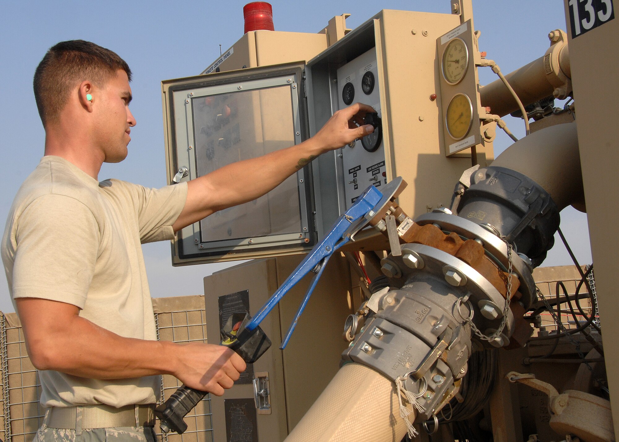 SOUTHWEST ASIA -- Airman 1st Class Lawson McLester, 386th Expeditionary Logistics Readiness Squadron Fuels Management Flight, checks the FORCE Fuel equipment for proper operation on Nov. 4 at an air base in Southwest Asia. Airman McLester is deployed from Aviano Air Base, Italy. (U.S. Air Force photo/Tech. Sgt. Raheem Moore) 