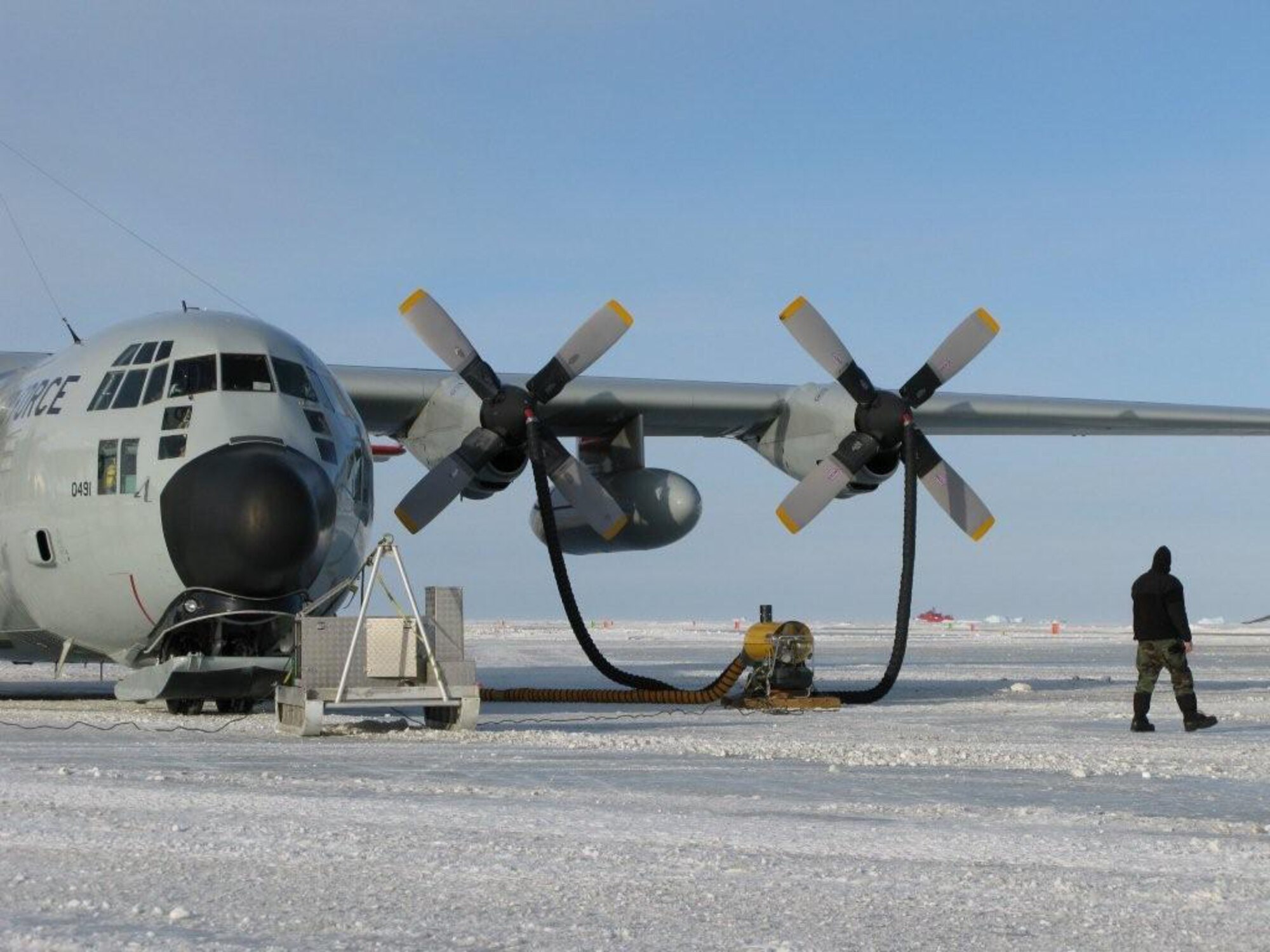 An LC-130 Hercules sits on an improvised ice runway at Davis Station, Antarctica, Nov. 3.  A U.S. and Australian medical team moved an injured Australian civilian aboard the aircraft from the camp to a hospital in Hobart, Australia, Nov. 5.  The mission was flown as part of Operation Deep Freeze, commanded by U.S. Pacific Command's Joint Task Force Support Forces Antarctica at Hickam Air Force, Hawaii.  (Courtesy photo)