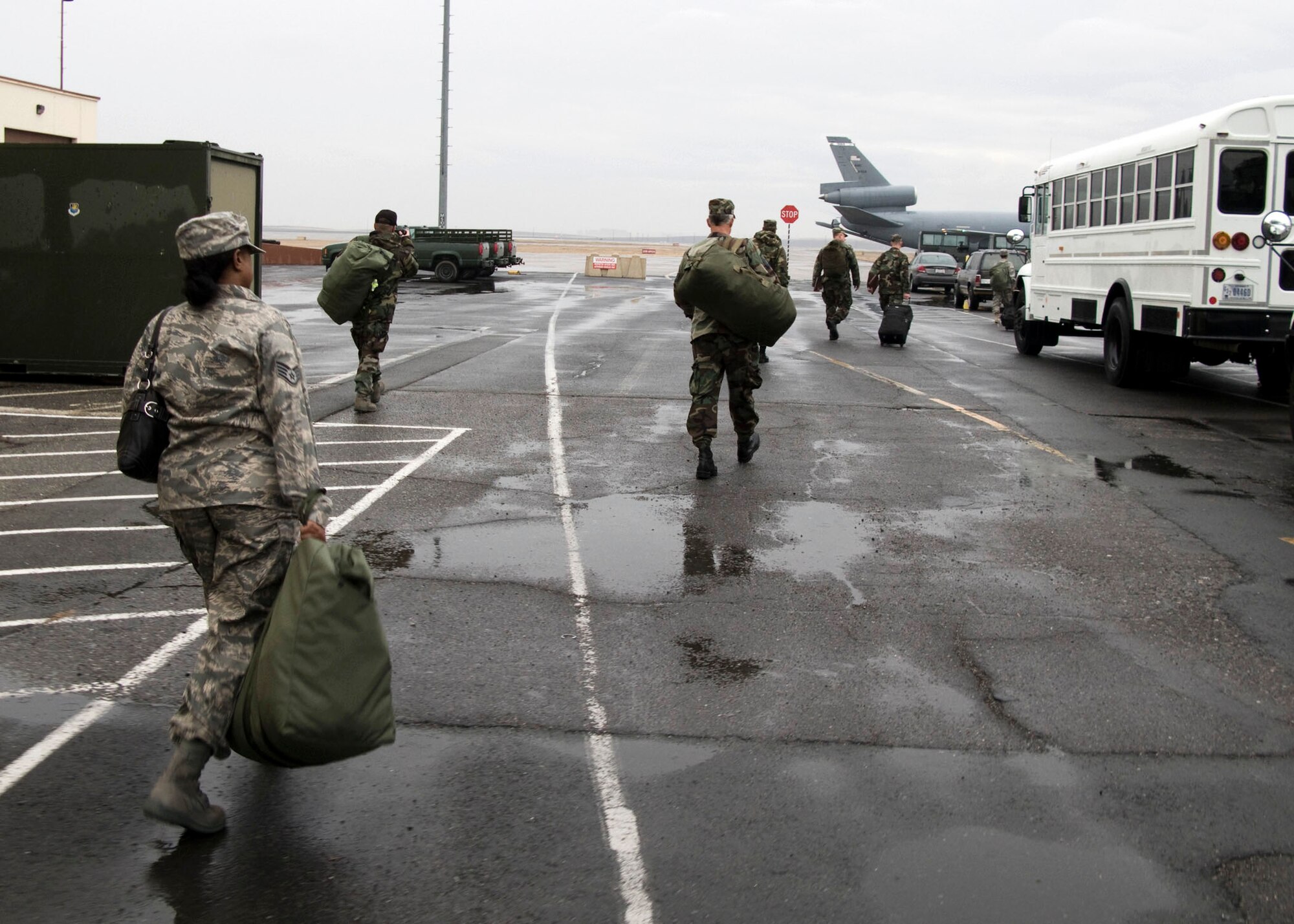 TRAVIS AIR FORCE BASE, Calif. -- Airmen from the 349th Air Mobility Wing walk from one station to another in a deployment processing exercise Nov. 1, 2008. The deployment process ensures Airmen are properly equipped, fully qualified and quickly transported to their wartime or contingency mission. This exercise is just one of several preparing the unit for a major operational inspection next year. (U.S. Air Force photo / Maj. Robert Couse-Baker)349th Air Mobility Wing Mobility Exercise, Nov. 1, 2008.