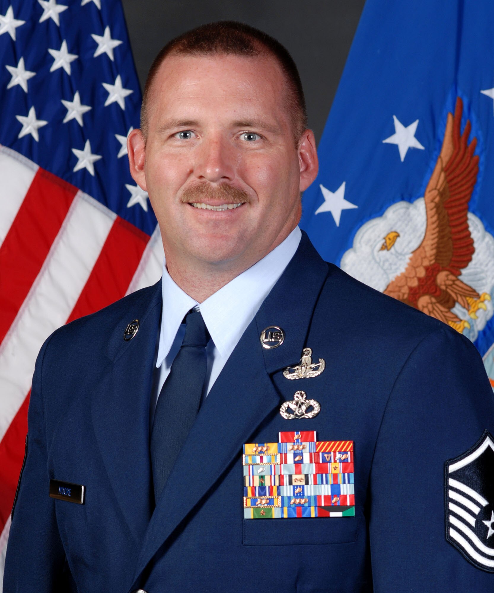 Master Sgt. Douglas Moore, 18th Civil Engineer Squadron superintendent of the Explosive Ordnance Disposal flight, is one of 16 Airmen featured in the current volume of Portraits in Courage.
(U.S. Air Force photo/Junko Kinjo)
