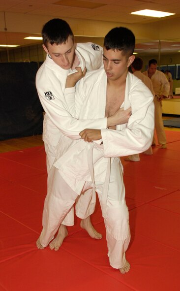 BARKSDALE AIR FORCE BASE, La. - Airmen 1st Class Crispin Hasley and Kevin Combs from the 2d Aircraft Maintenance Squadron, practice a technique learned in the Kodokan Judo class.  Judo is a form of self- defense.  It takes place at the Fitness Center on Tuesdays for juniors starting at 6 p.m., and Thursdays for seniors starting at 7 p.m.  (Air Force photo by Senior Airman Alexandra Sandoval) (Released)