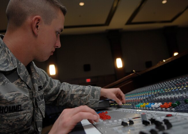 Airman 1st Class Amos Hommel performs sound engineering during the Airlift Tanker Association briefing on Charleston AFB Nov. 4. The ground radio shop provides communication support and maintenance to Charleston AFB with land mobile radios, mass notification systems as well as other transmission systems. Airman Hommel is a radio maintenance technician from the 437th Communications Squadron. (U.S. Air Force photo/Airman 1st Class Katie Gieratz) 