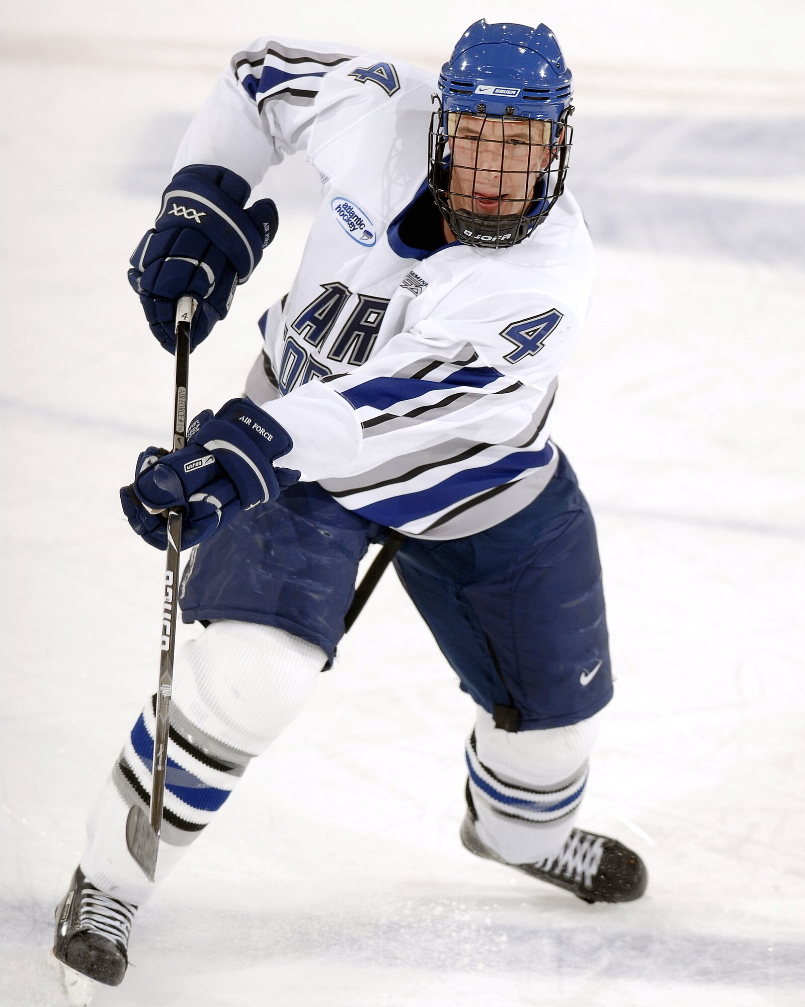 Air Force Academy defenseman Greg Flynn takes a shot as Air Force defeated Bentley College 5-1 in an Atlantic Hockey Association game Oct. 31 at the Academy's Cadet Ice Arena in Colorado Springs, Colo.  The next evening, the Academy skaters defeated Bentley 8-2, giving them a perfect 8-0 start, which ties a school record set in 1971-72. Air Force currently is ranked 14th in the nation.  (U.S. Air Force photo/Mike Kaplan)
