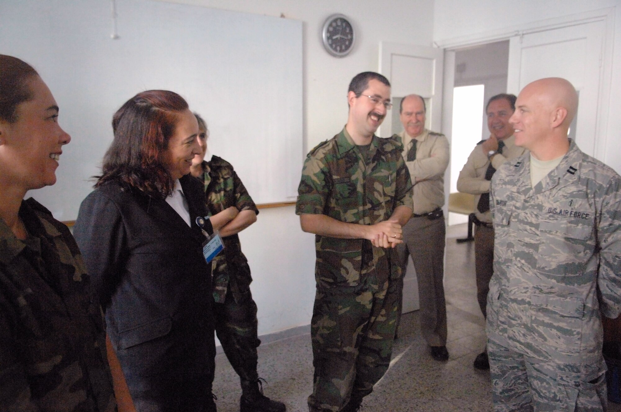 Capt. Timothy Bonjour talks with Uruguayan counterparts Nov. 3 in Uruguay. He is part of a Defense Institute for Medical Operation disaster response and medical technique exchange. Captain Banjour is stationed at Travis Air Force Base, Calif. (U.S. Air Force photo/Tech. Sgt. Roy Santana)