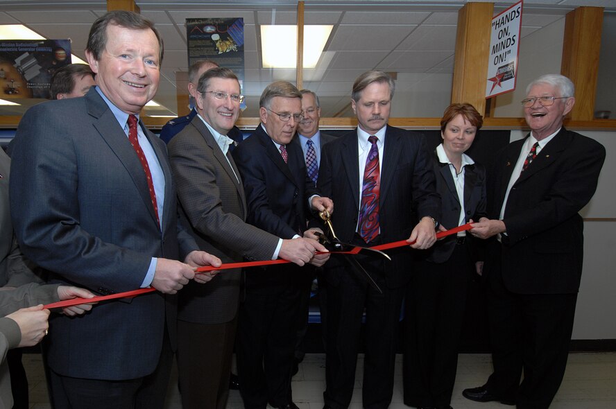 MINOT AIR FORCE BASE, N.D. -- (From left to right) N.D. Congressman Earl Pomeroy, N.D. Senator Kent Conrad, N.D. Senator Byron Dorgan, N.D. Governor John Hoeven, Terri Vigstol, STARBASE North Dakota instructor, and Dr. Wayne Sanstead, N.D. Department of Public Instruction state superintendent, slice through the ribbon during a ceremony which signaled the official welcome of STARBASE in North Dakota here Nov. 3. The Department of Defense-funded education program STARBASE program brings fifth-graders here once a month for five days of science, technology, engineering and math – including launching rockets, and motivates children to harness the power of the mind through hands-on, minds-on learning and development. (U.S. Air Force photo by Senior Airman Kelly Timney)