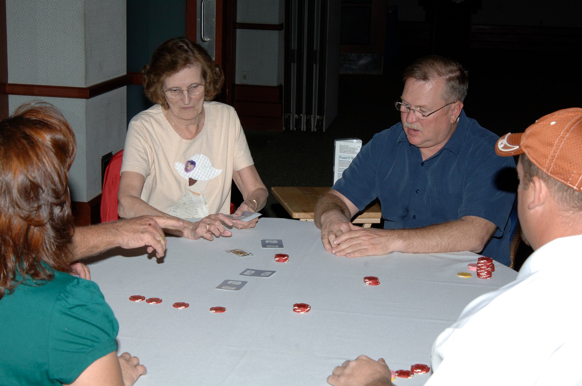 MCCONNELL AIR FORCE BASE, Kan. -- Team McConnell members play Texas Hold’em during a tournament held by 22nd Force Support Squadron at Club McConnell, Nov. 1.  The 22nd Force Support Squadron holds tournaments every Saturday at 6 and 8 p.m. until Nov. 15.  The winner of each session earns a seat at the final tournament Nov. 22, where the final tournament winner will win $500 in services bucks.   (Photo by Staff Sgt. Ronald Lafosse)