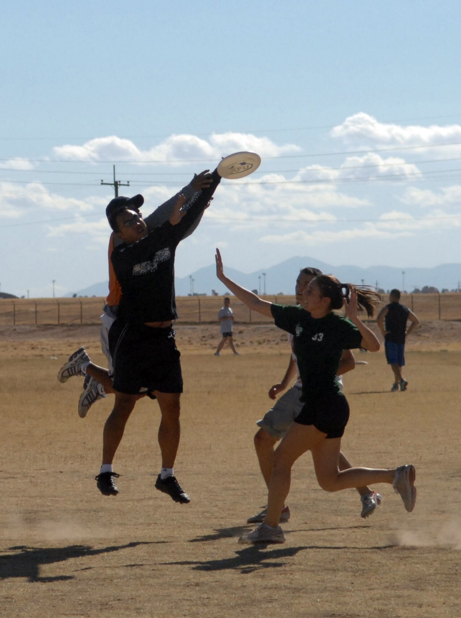 Airmen from Twelfth Air Force and Air Forces Southern compete in an ultimate frisbee competition during their third bi-annual sports day here Nov. 3. (U.S. Air Force photo/Airman 1st Class Jamie L. Coggan)