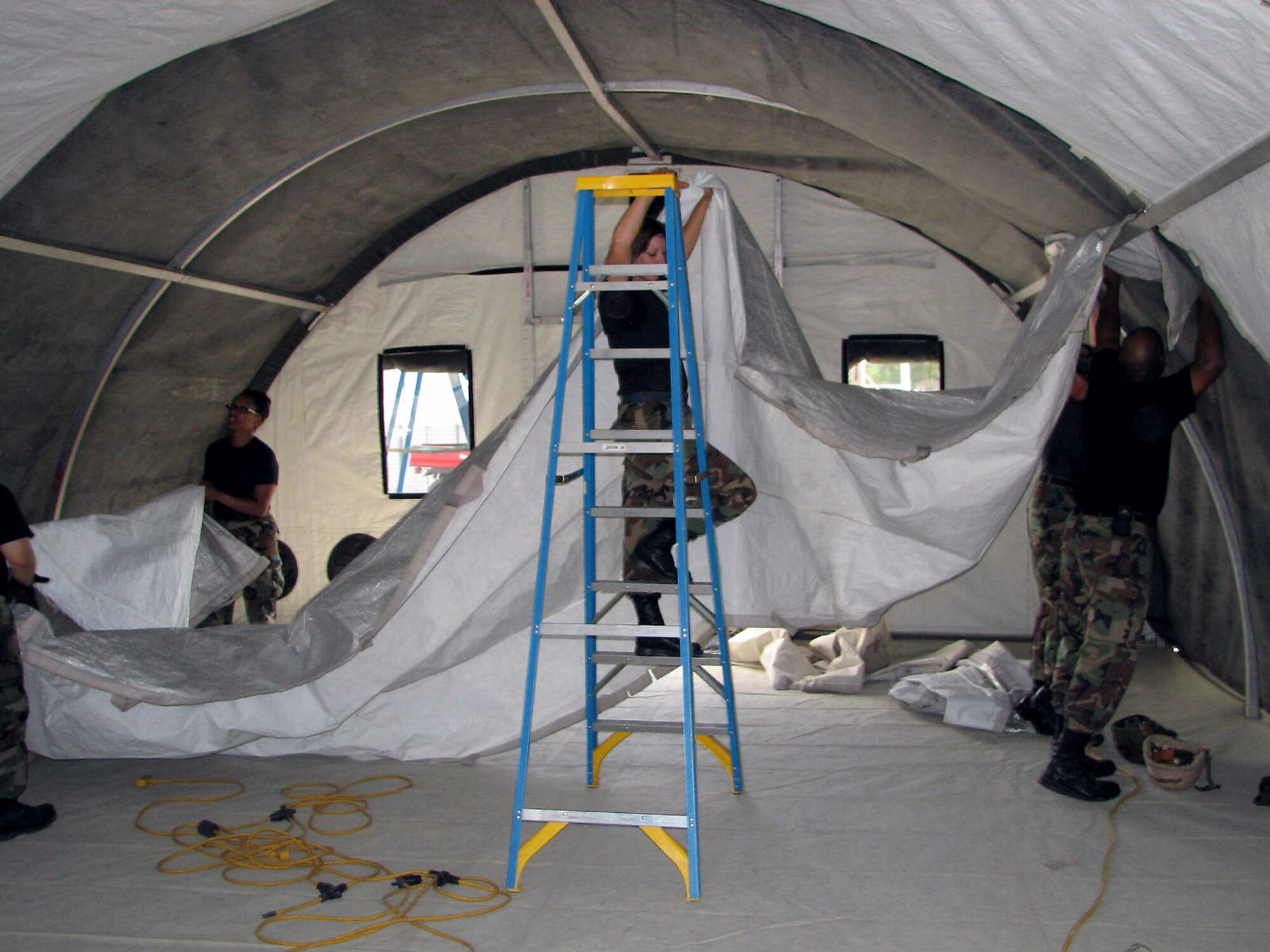 Airmen take part in Silver Flag's tent-building exercise at Tyndall Air Force Base, Fla. More than 140 Silver Flag students set up 10 shelters in preparation for a forward deployment exercise later in the week. (U.S. Air Force photo/Master Sgt. Charlie Carr)
