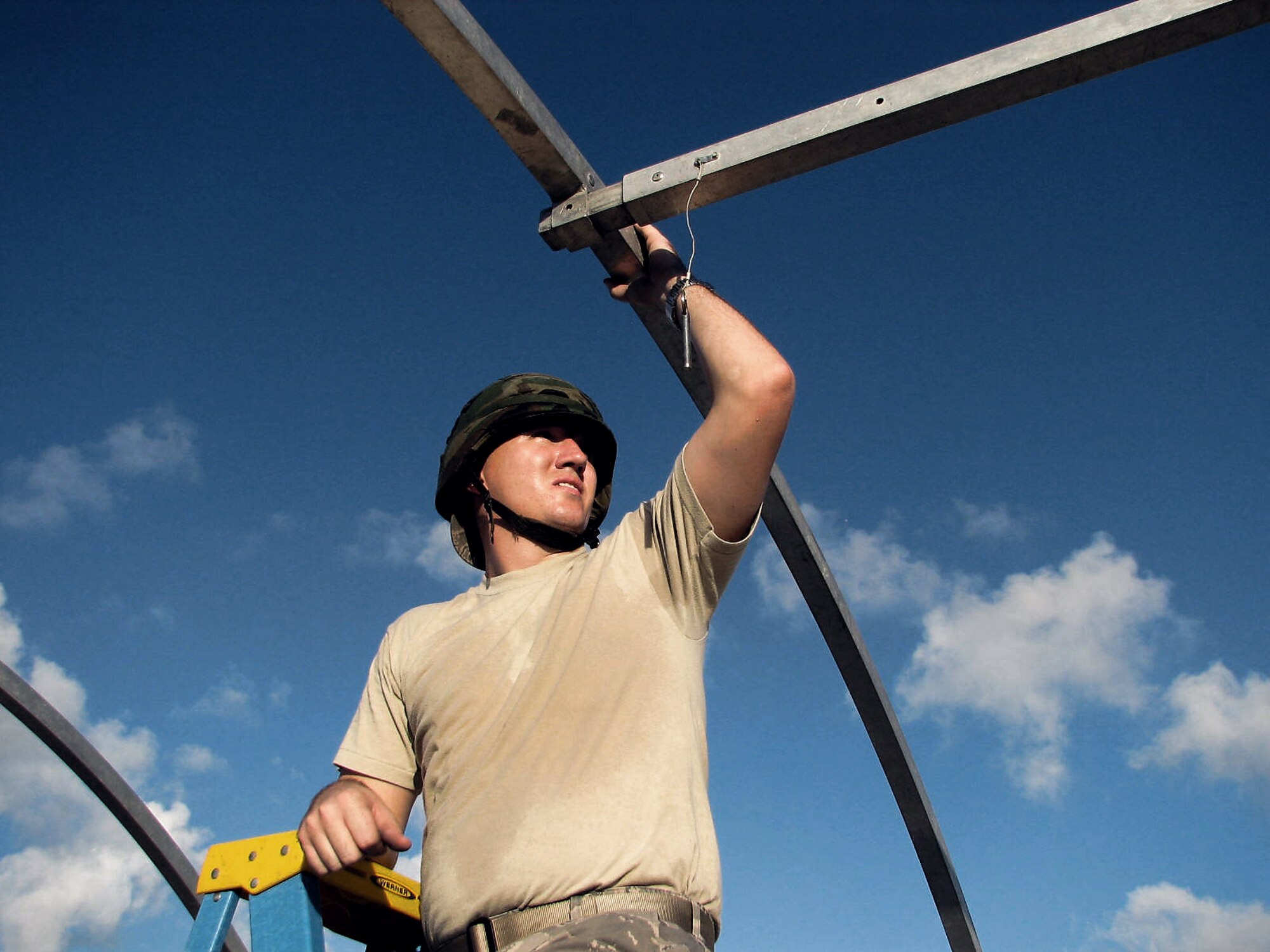 Capt. Jody Hodges steadies a supporting pole during a Silver Flag tent-building exercise at Tyndall Air Force Base, Fla. Every year, about 7,600 Airmen from a variety of career fields visit Tyndall AFB to improve their contingency skills and to learn how to open, establish and sustain a forward operating base.(U.S. Air Force photo/Master Sgt. Charlie Carr) 
