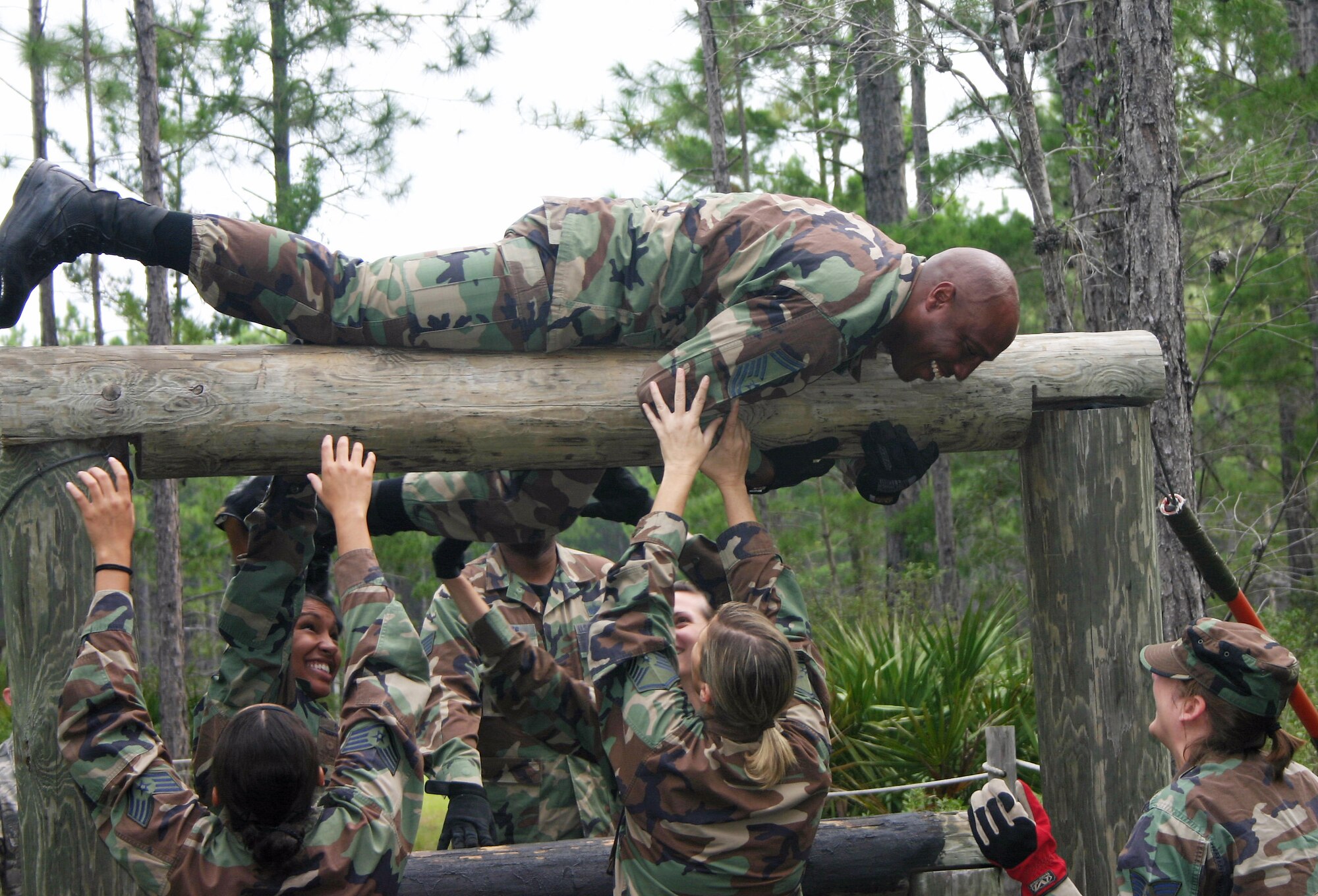 Senior Master Sgt. Nate Tennyson tackles the 823rd Red Horse Squadron's obstacle course during a Silver Flag exercise at Tyndall Air Force Base, Fla. Silver Flag provides contingency training where Airmen from various career fields can train and interact in a realistic environment. (U.S. Air Force photo/Richard Salomon) 
