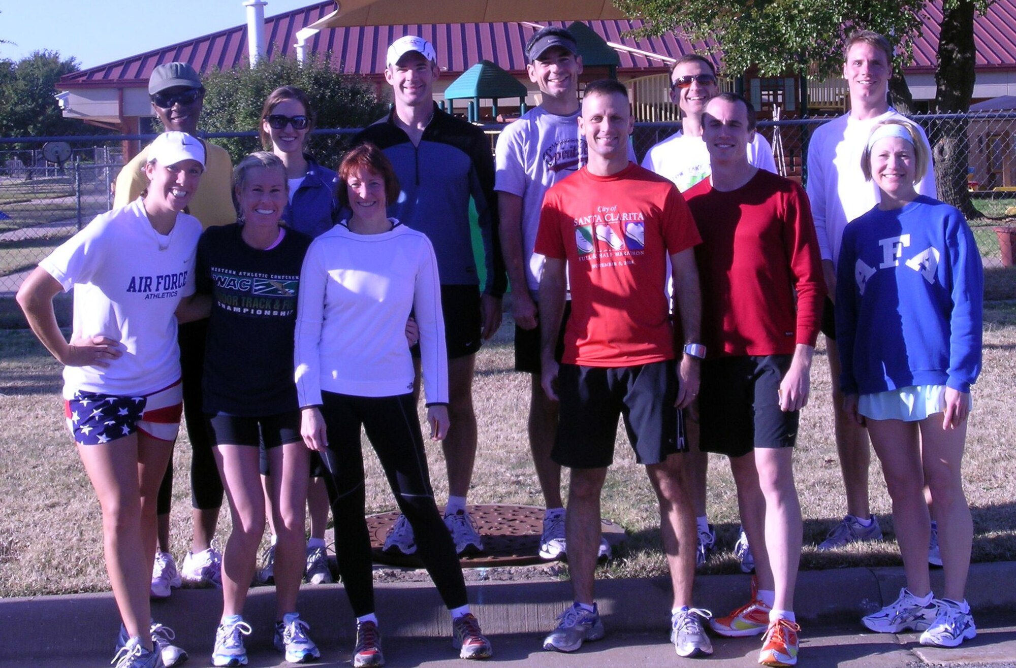 Commander’s 5K division winners smile following the run Nov. 1. Back row (from left): Rhonda Patton (31:30), 2nd Lt. Agneta Murnan (21:59), Maj. Jason Smith (18:18), Master Sgt. Troy Crowell (17:19), Lt. Col. Neil Woods (19:17), and 1st Lt. Chris Behrens (17:35). Front Row (from left):  2nd Lt. Kim Brady (21:23), Andrea St. Clair (21:01), Rhonda Farrington (28:48), Maj. Randall Schmedhorst (19:17), 1st Lt. Matthew Gjertsen (19:46) and Col. Jennifer Graham (25:51). (U.S. Air Force photo by Elaine Johns)