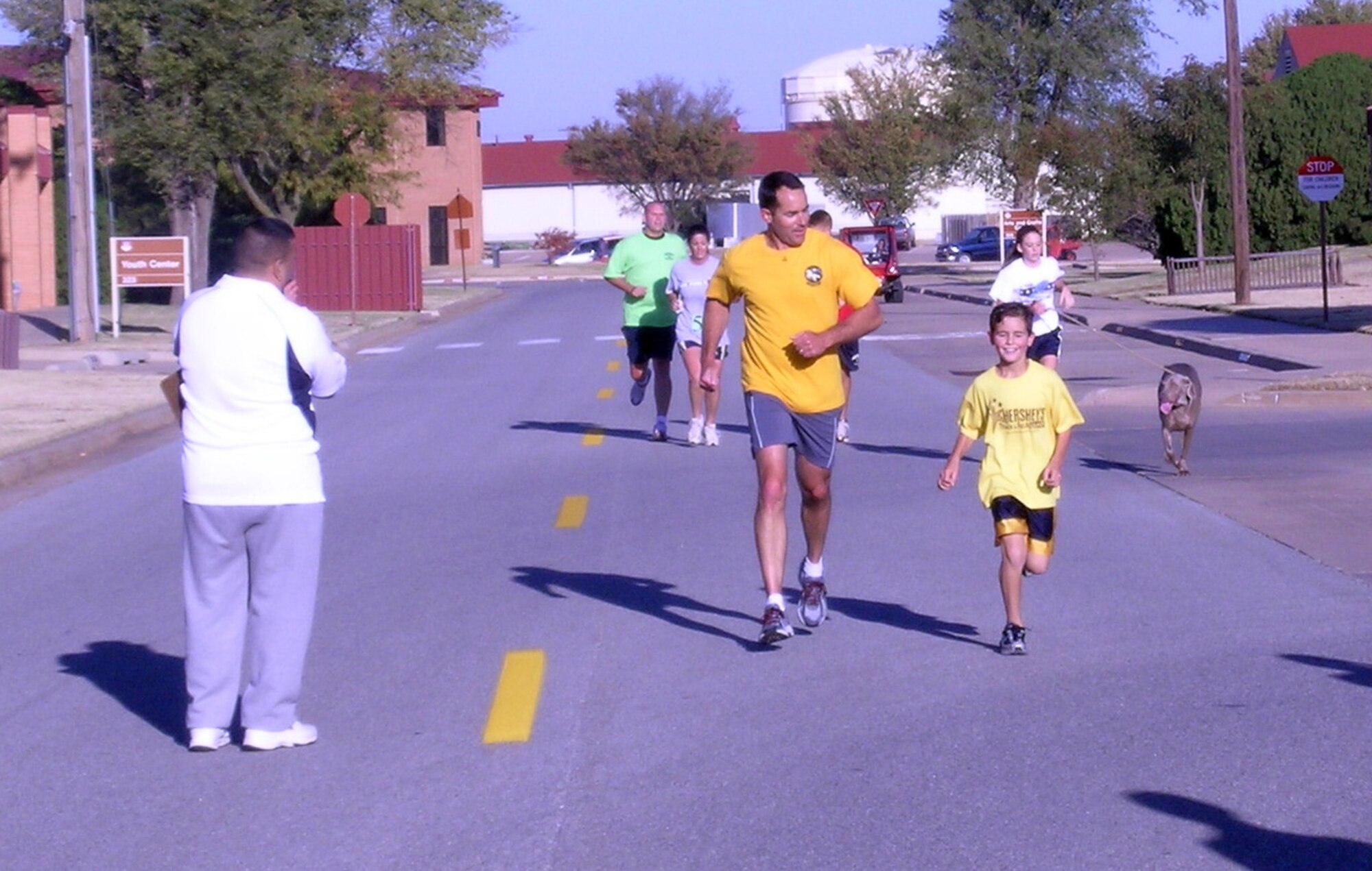 Lt. Col. Vincent Lostetter, 71st Operations Support Squadron commander, and his son Nicholas cross the finish line at the Commander’s 5K Nov. 1. (U.S. Air Force photo by Elaine Johns)
