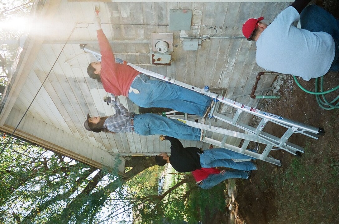 Volunteers from Vance Air Force Base and the local community participate in a program called "Christmas in Action," by repairing the home of a local veteran. (Courtesy photo)
