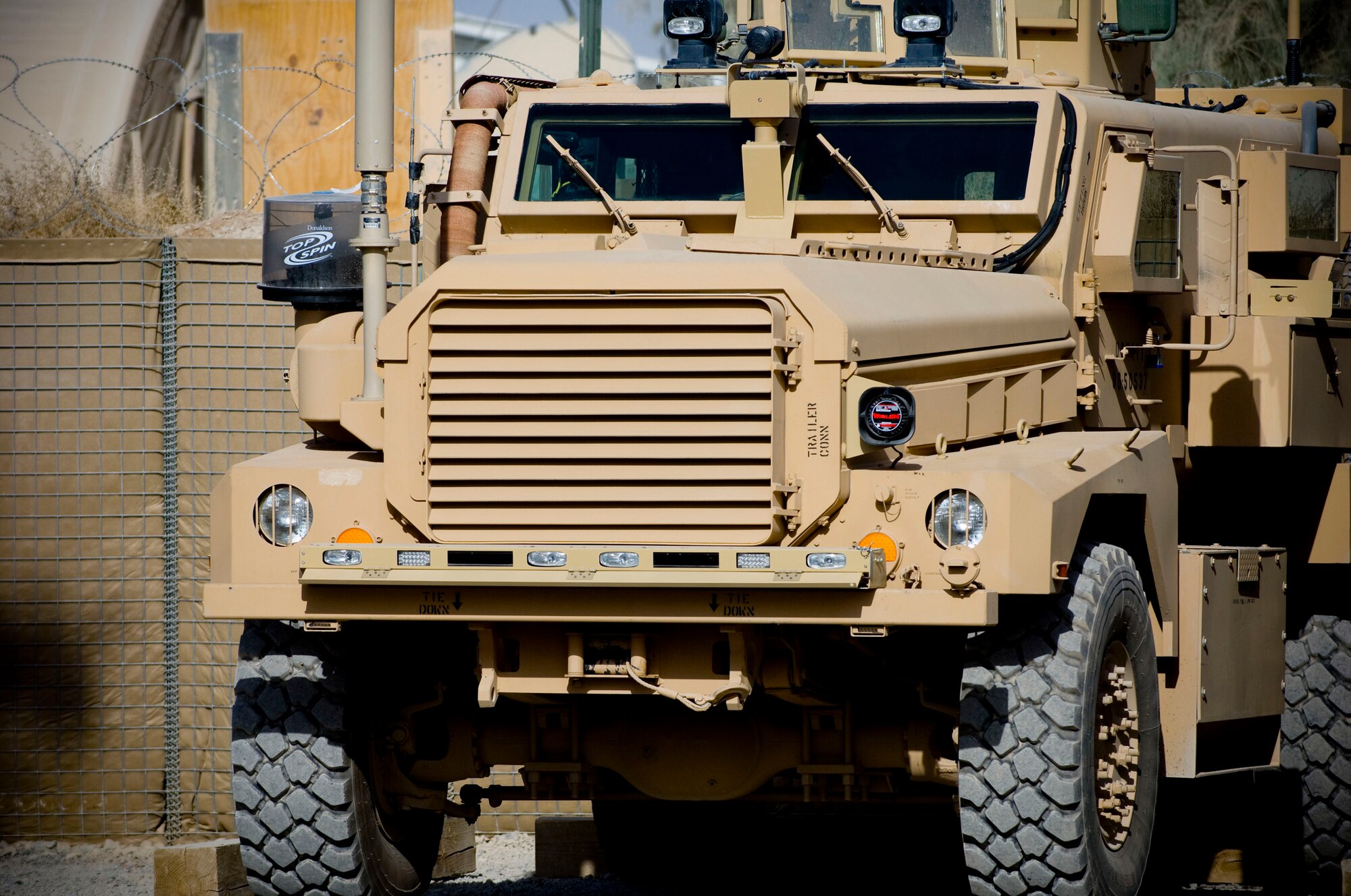 A mine-resistant, ambush-protected vehicle stands ready at the 755th Air Expeditionary Group Explosive Ordnance Disposal Operation Location-Bravo, Kandahar Air Field, Afghanistan, Oct. 26. MRAPs provide a great deal safety and security for EOD teams, incorporating thick armor and a v-shaped hull to deflect blasts away from passengers. (U.S. Air Force photo by Staff Sgt. Samuel Morse/Released)