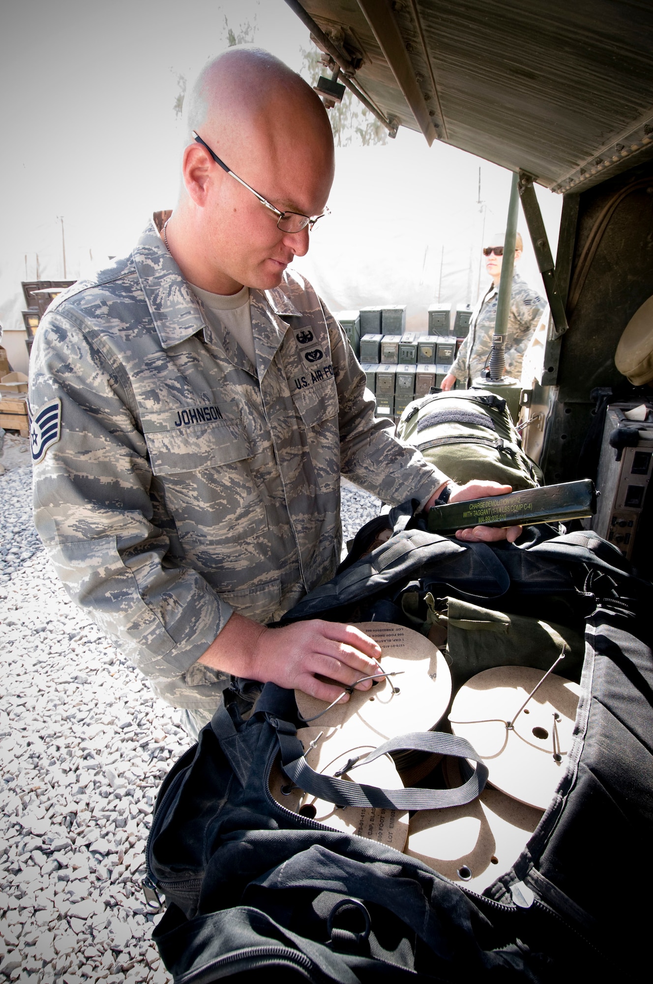 Staff Sgt. Tyson Johnson, 755th Air Expeditionary Group Explosive Ordnance Disposal Operation Location-Bravo, inventories a backpack containing materials for detonating explosives at Kandahar Air Field, Afghanistan, Oct. 26. The EOD teams keep everything needed to handle just about any incident ready to go so they can respond at a moment's notice. During a five month period, EOD OL-B responded to 326 incidents, destroying 130,837 pieces of ordinance at a combined weight of 15,188 pounds. Sergeant Johnson is deployed from Peterson Air Force Base, Colo., and hails from Salt Lake City, Utah. (U.S. Air Force photo by Staff Sgt. Samuel Morse/Released)